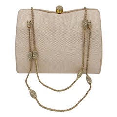 Borsa Judith Leiber con tracolla in cristallo e lucertola rosa