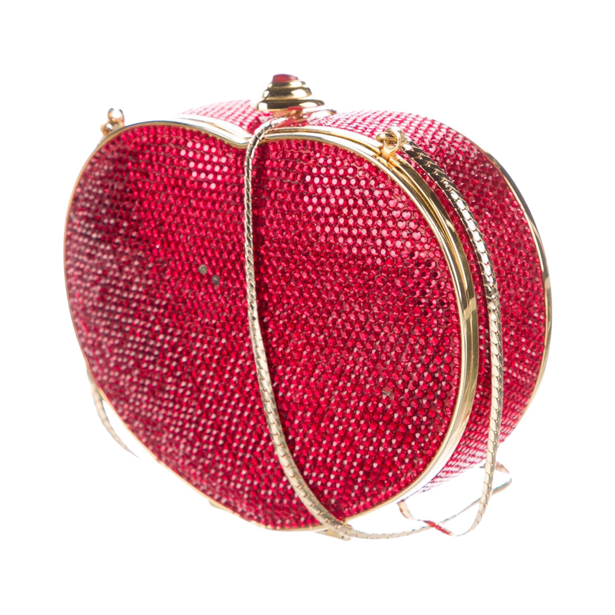 Judith Leiber Minaudière.Red Crystal. Gold-Tone Hardware. Chain-Link Shoulder Strap. Leather Lining. Push-Lock Closure at Top. Handbags are final sale and are not returnable.

Height 4