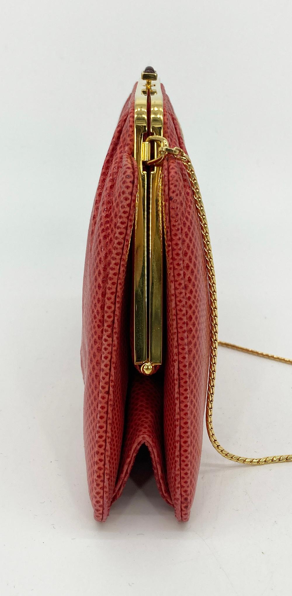 Judith Leiber Red Lizard Small Shoulder Bag in very good vintage condition. Red lizard leather trimmed with gold hardware and gold chain shoulder strap. Top button closure opens to a red nylon interior with one slit side pocket. Overall very good