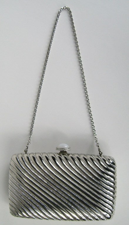 JUDITH LEIBER Silver Clutch.  New, Old stock. Measuring 6-1/4 x 3-7/8. New With Tags Retail 2995.00. Please be sure to check our storefront for more fashion as we have both Vintage and Contemporary fashions. This is ready to wear!  We also have