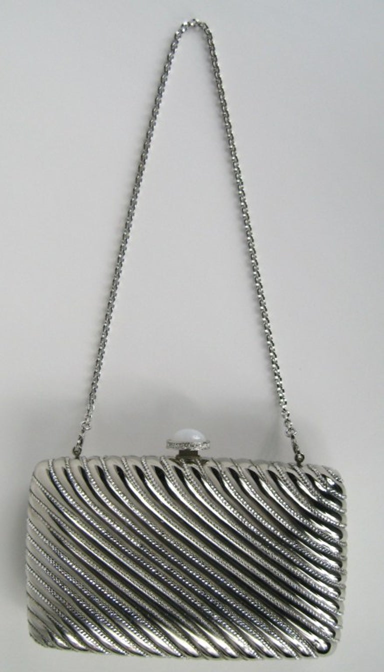 JUDITH LEIBER Silver Clutch.  New, Old stock. Measuring 6-1/4 x 3-7/8. New With Tags Retail 2995.00. Please be sure to check our storefront for more fashion as we have both Vintage and Contemporary fashions. This is ready to wear!  We also have