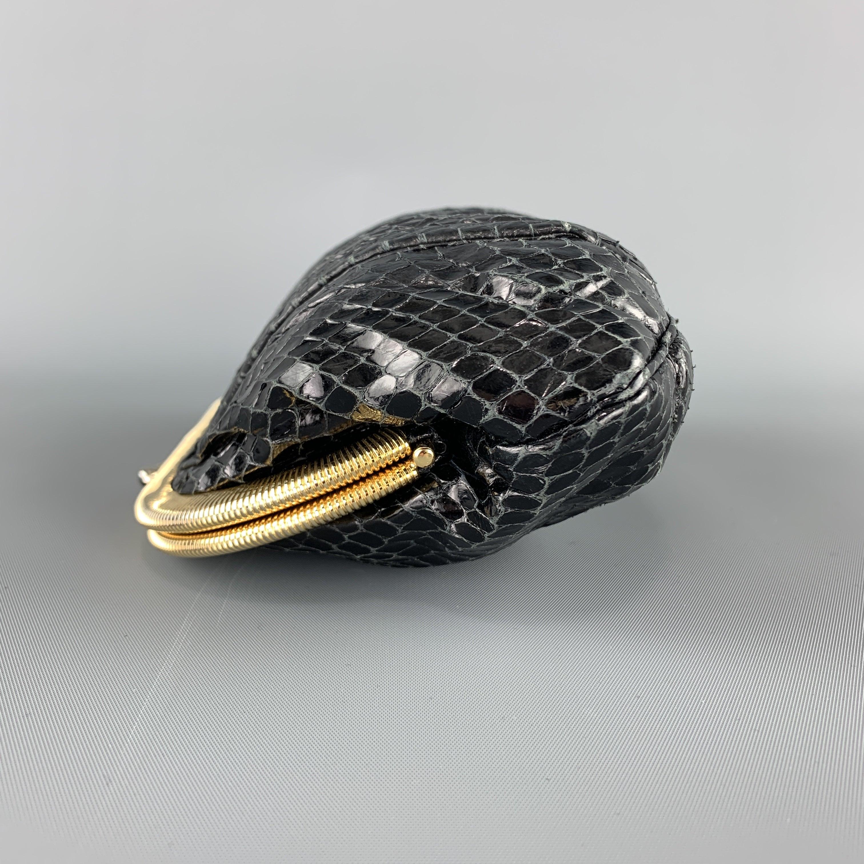 JUDITH LEIBER evening clutch comes in black pleated snake skin leather with a gold tone kiss lock closure and chain strap. 
Excellent Pre-Owned Condition.
 

Measurements: 
  Length: 8 inches Width:
2 inches Height:
5 inches Drop: 20 inches 
  
  
