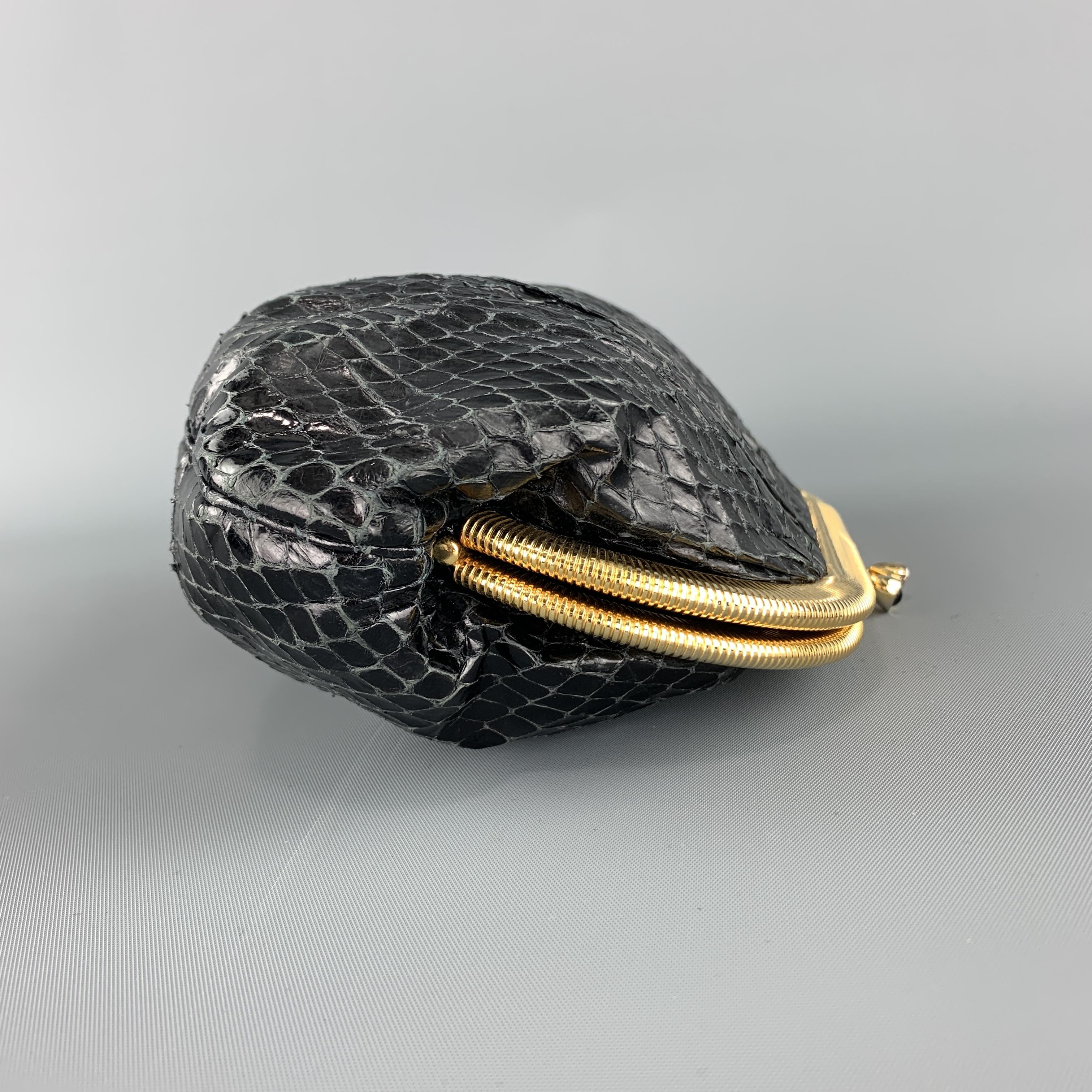 JUDITH LEIBER evening clutch comes in black pleated snake skin leather with a gold tone kiss lock closure and chain strap. 

Excellent Pre-Owned Condition.

Measurements:

Length: 8 in.
Width: 2 in.
Height: 5 in.
Drop: 20 in.