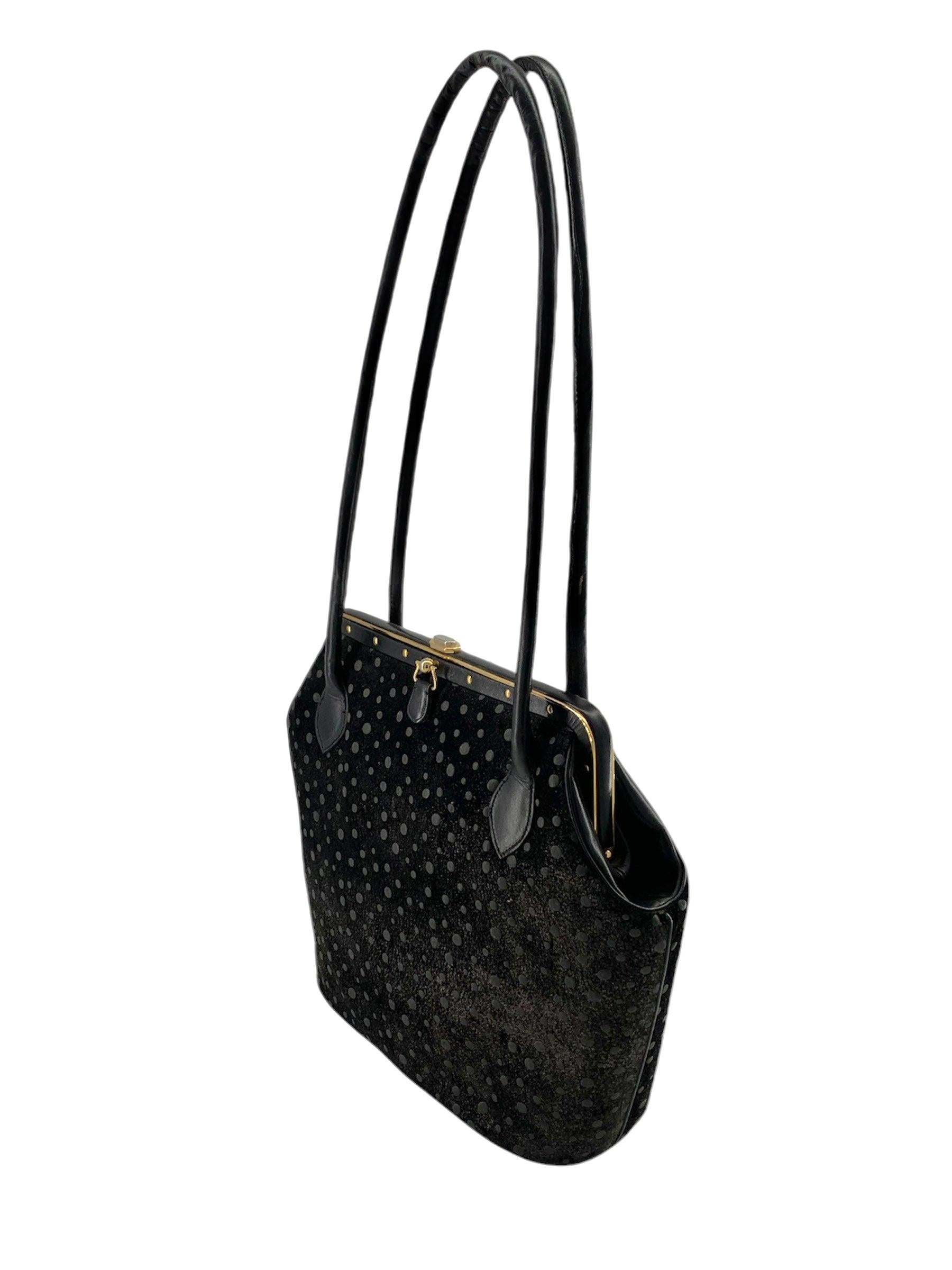 Shimmery, celestial polka dot suede (feels like velvet!) bag by Judith Leiber. Circa 1990s. A rare and wonderfully large sized bag from Leiber. Long straps for ease of movement. Gold toned hardware. Inner pockets on both sides. Matching black