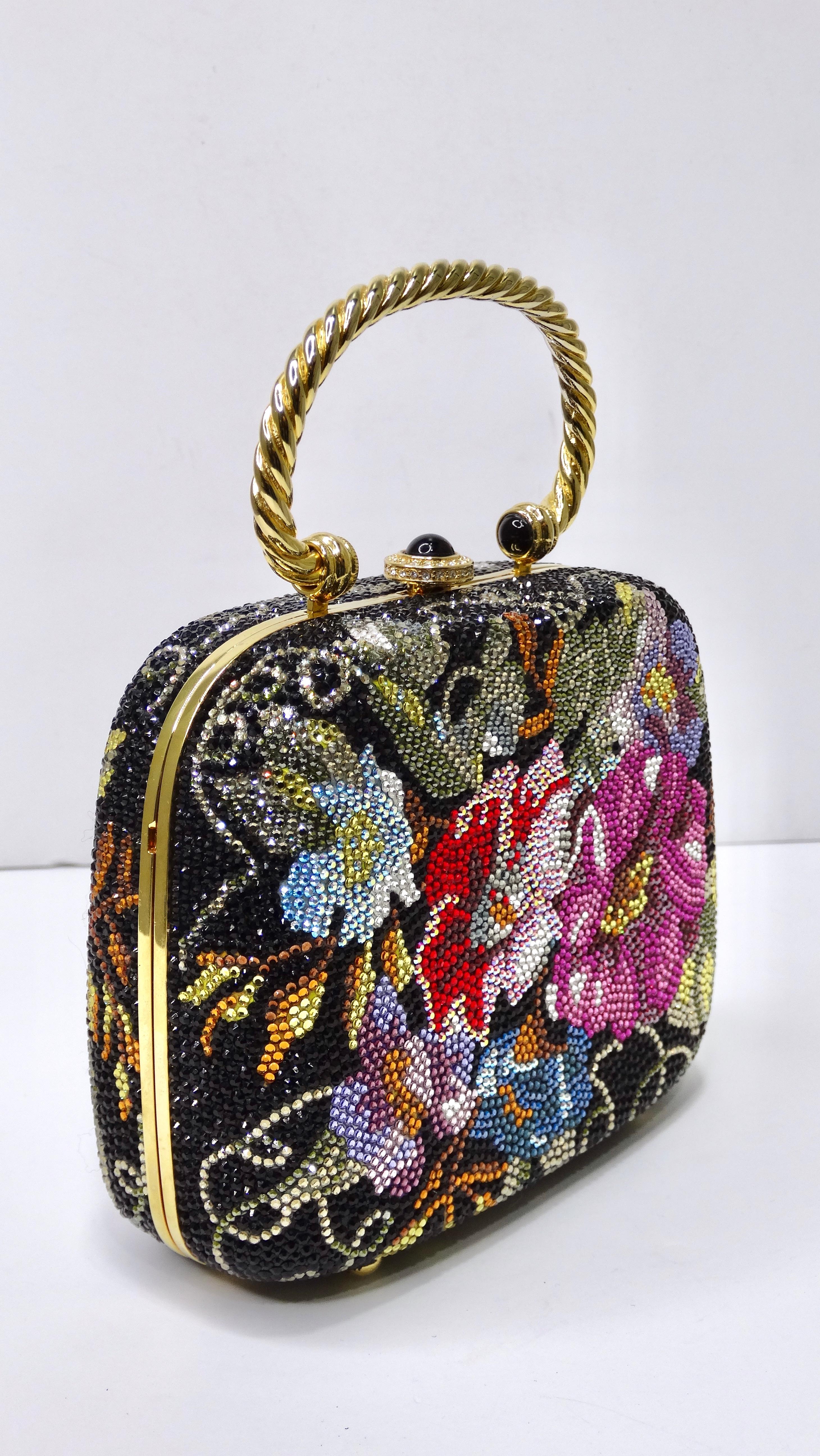 Elegance and glamor right this way! This is a highly designed handbag by none other than Judith Leiber that will be sure to catch people's attention from across the room. This is a BEAUTIFUL Judith Leiber flower motif Swarovski Crystal Minaudiere