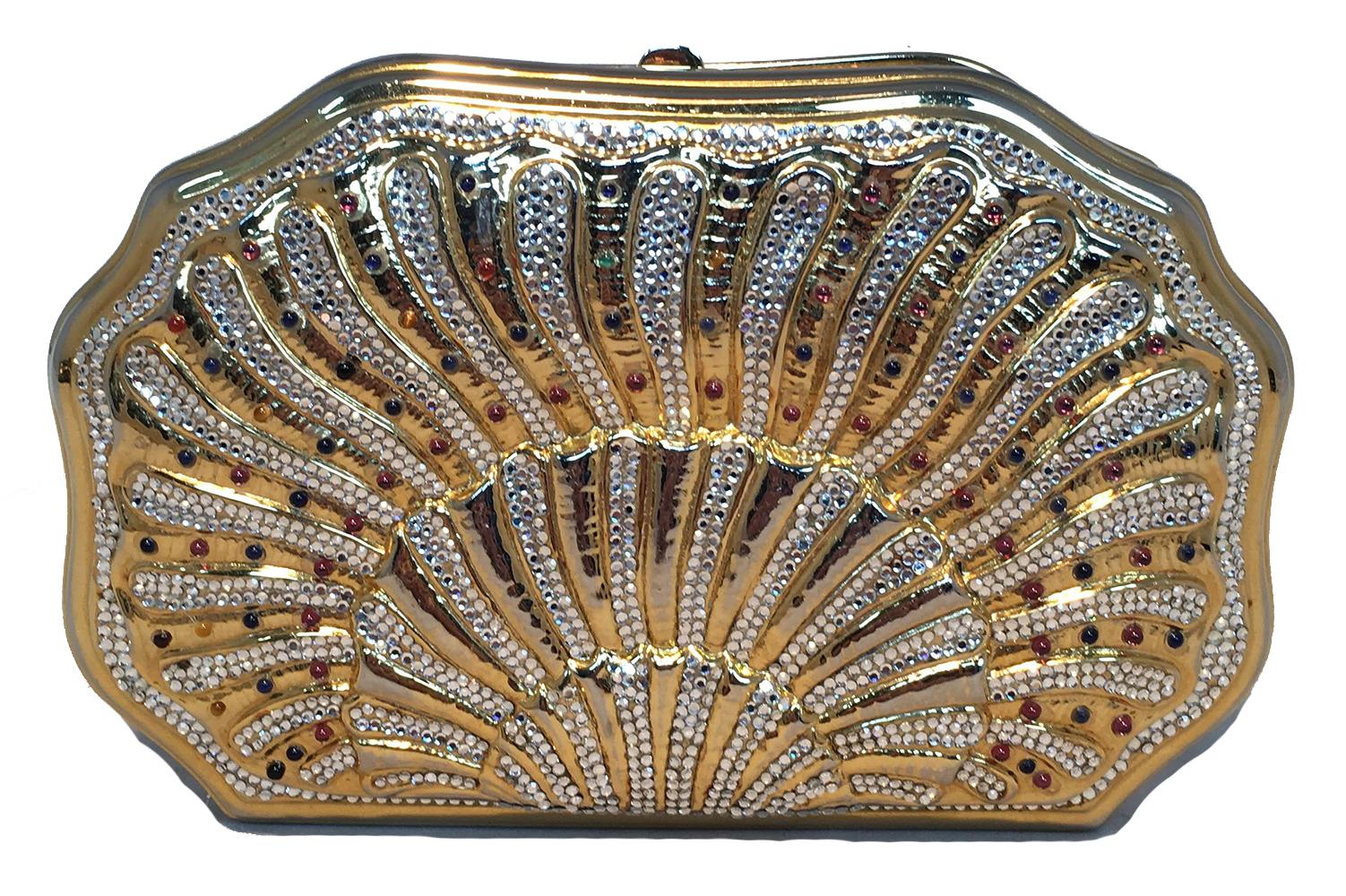 Judith Leiber Swarovski Crystal Gemstone Shell Minaudiere Evening Bag in excellent vintage condition. Gold shell shape with clear swarovski crystals and tiny multicolor gemstone details. Top button closure opens to a gold leather interior that holds