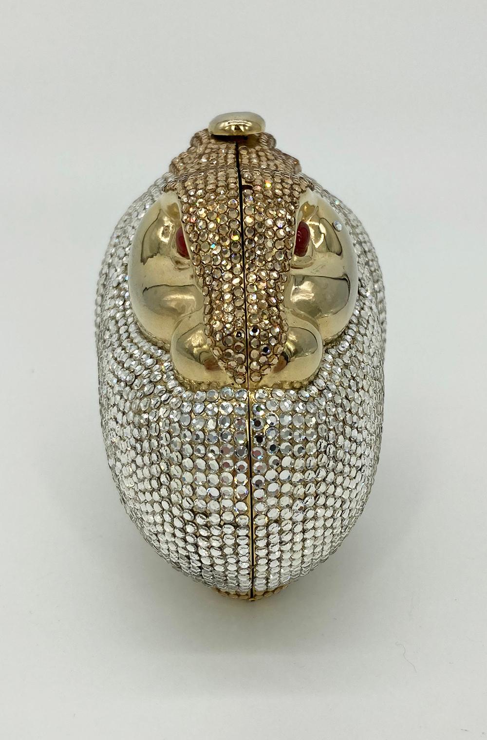 Judith Leiber Swarovski Crystal Bunny Rabbit Minaudiere in excellent condition. Unique and rare rabbit shape with silver cyrstal body, smooth gold face, and gold crystal ears on top. Red cabochon gemstone eyes with one small crystal beauty mark on