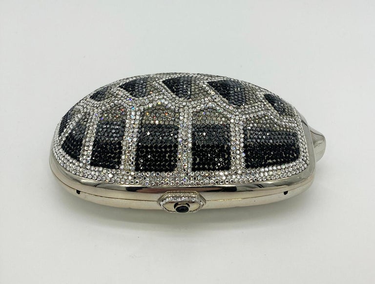 Judith Leiber Swarovski Crystal Turtle Minaudiere in excellent condition. Silver Turtle shape trimmed with black grey silver and clear swarovski crystals. Top shell covered in crystals while head, edges and base are solid silver. Side button closure