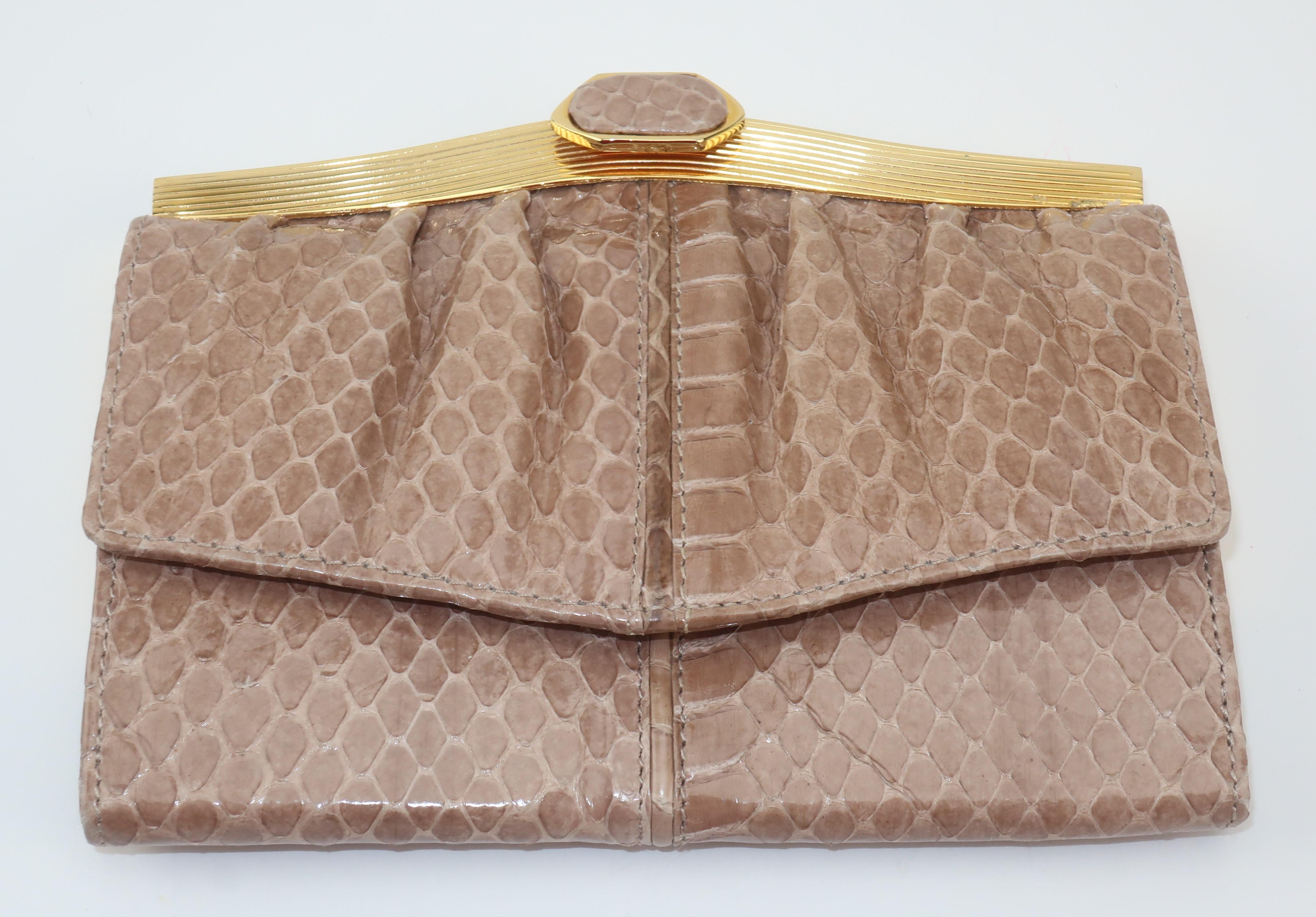 Lovely Judith Leiber tri-fold wallet in a neutral taupe snakeskin with coordinating leather interior and jewelry quality gold tone frame.  One side snaps open to reveal three bill sized compartments and the other side opens with a hinged clip