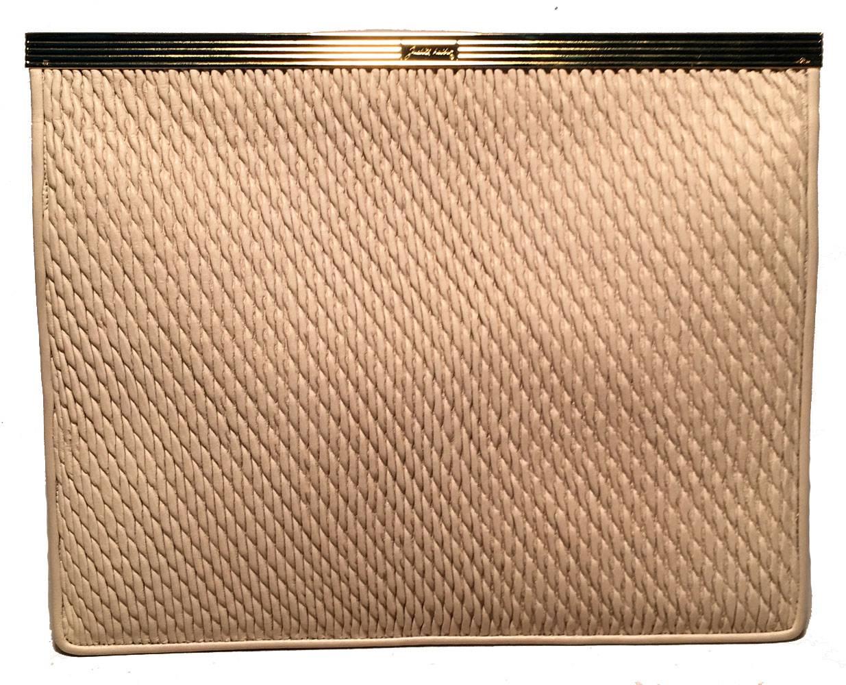 Beautiful Judith Leiber Vintage Cream Leather Clutch in excellent condition.  Soft cream leather exterior with textured pinched leather top front side/flap trimmed with gold hardware.  Single flap snap closure opens to a cream nylon interior that