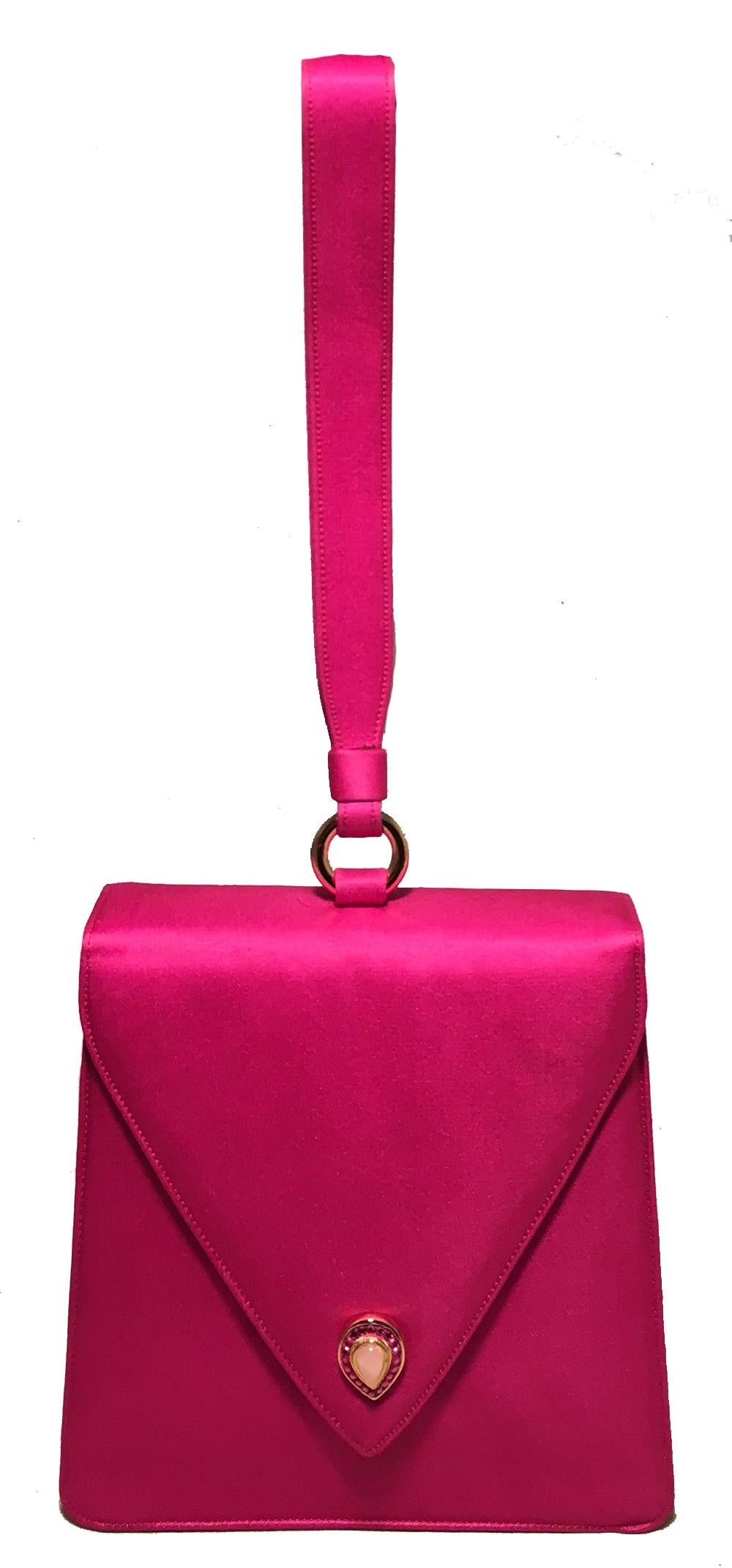 Judith Leiber Vintage Hot Pink Silk Evening Bag Wristlet in good condition. Hot pink silk exterior trimmed with a delicate front gold button with pink stone and crystal embellishments. Top flap snap closure opens to a pink silk interior that holds