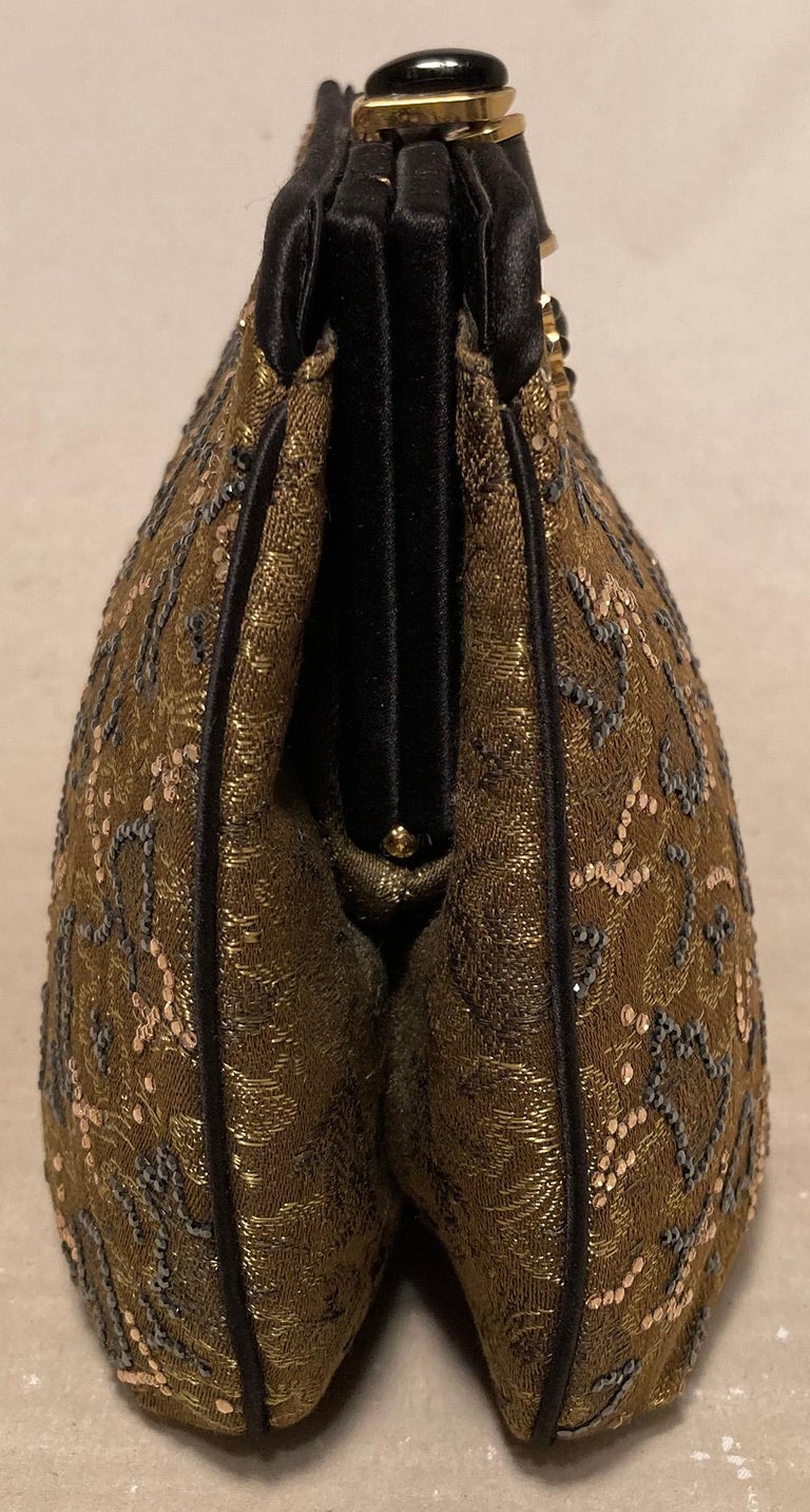 Judith Leiber Vintage Olive Silk Swarovski Crystal Evening Bag in excellent condition. Olive silk exterior trimmed with black silk and gold and grey swarovski crystals. Top button closure opens to a black silk interior with one side slit pocket. no