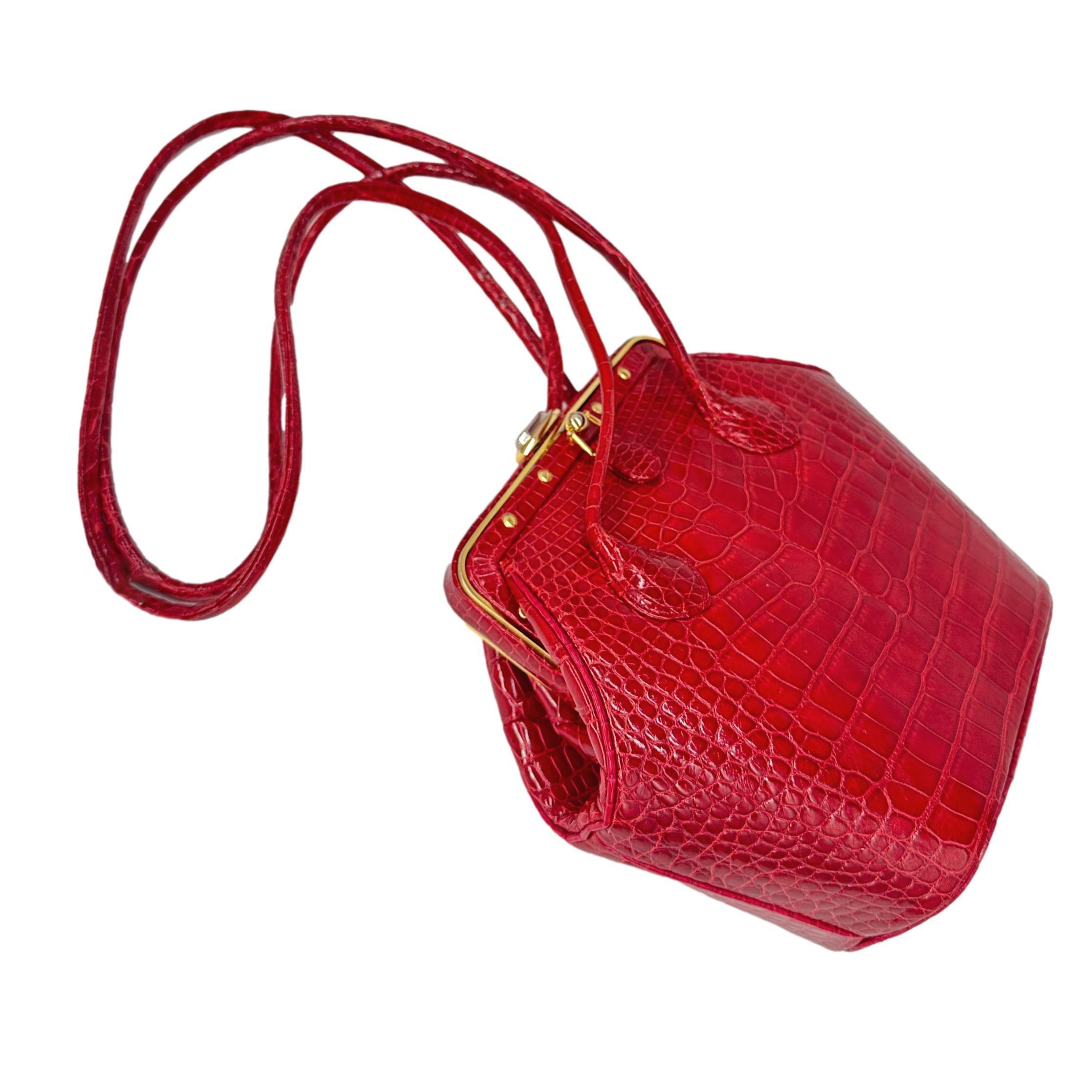 Judith Leiber Vintage Red Alligator Shoulder Minaudière Evening Bag, 1990. Exceptional and rare, this highly sought after piece of Judith Leiber history was produced between 1985 - 1990 and carried in high end department stores like Saks and