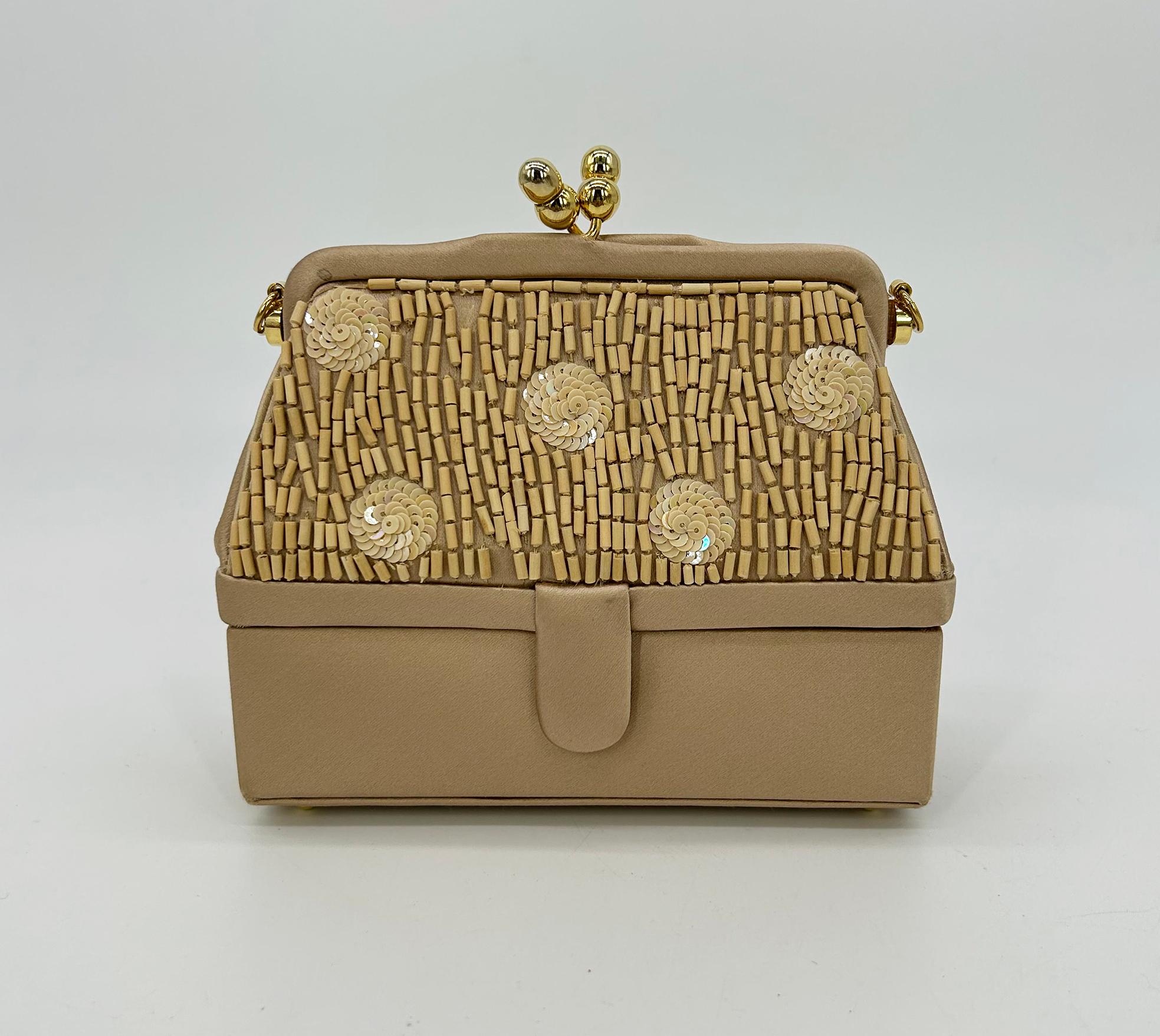 Judith Leiber Vintage Tan Silk Wood Bead Sequin Two Tier Minaudiere Bag in good condition. Tan silk exterior with very unique double compartment design. Top compartment features embroidered wood beads and iridescent sequens. Top kiss long closure