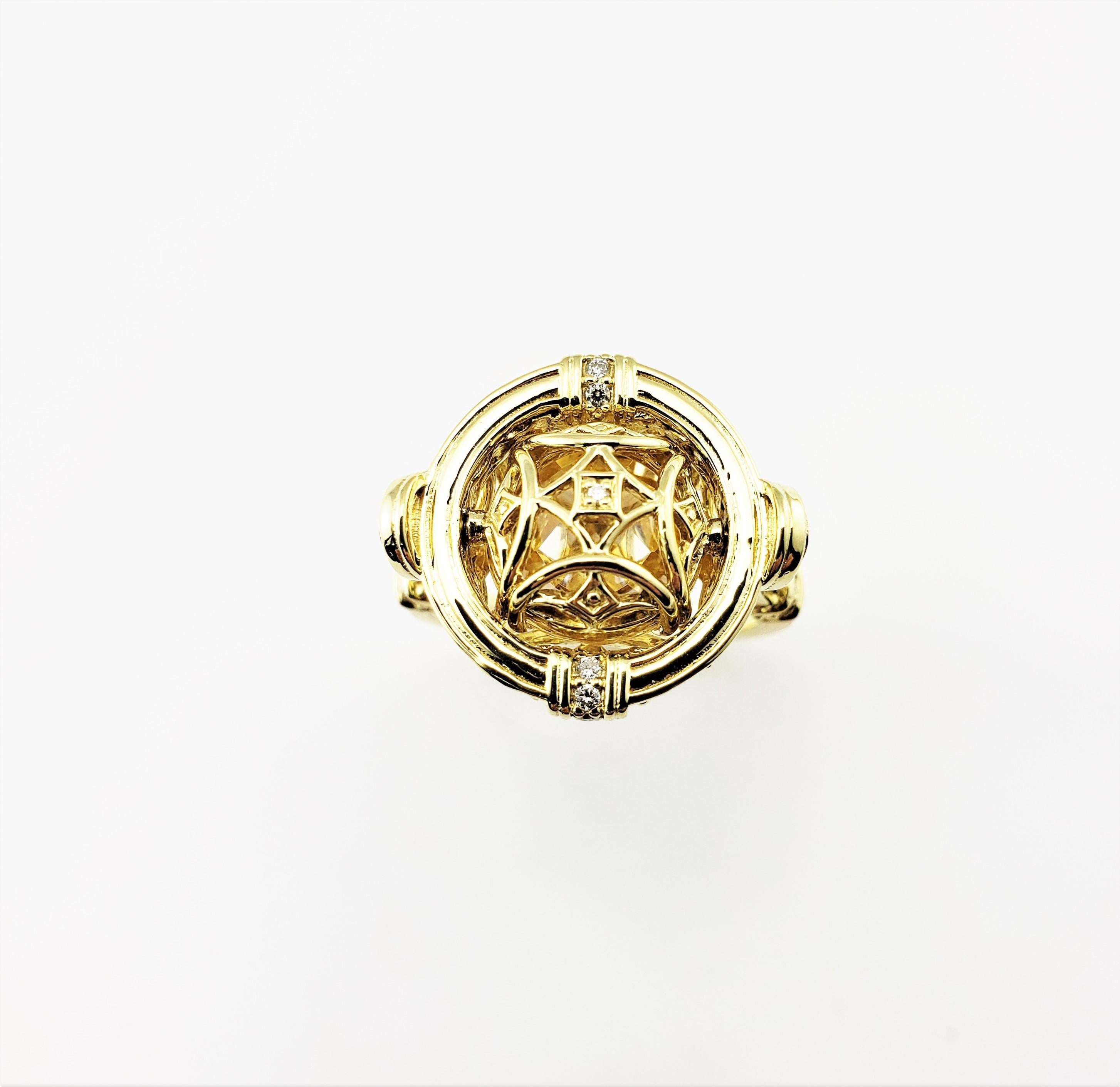 Judith Ripka 18 Karat Yellow Gold Yellow Topaz and Diamond Flip Ring Size 6.75-

This exquisitely crafted ring features one yellow topaz stone (11 mm) that flips to reveal a lovely open design.  Accented with 18 round brilliant cut diamonds set in