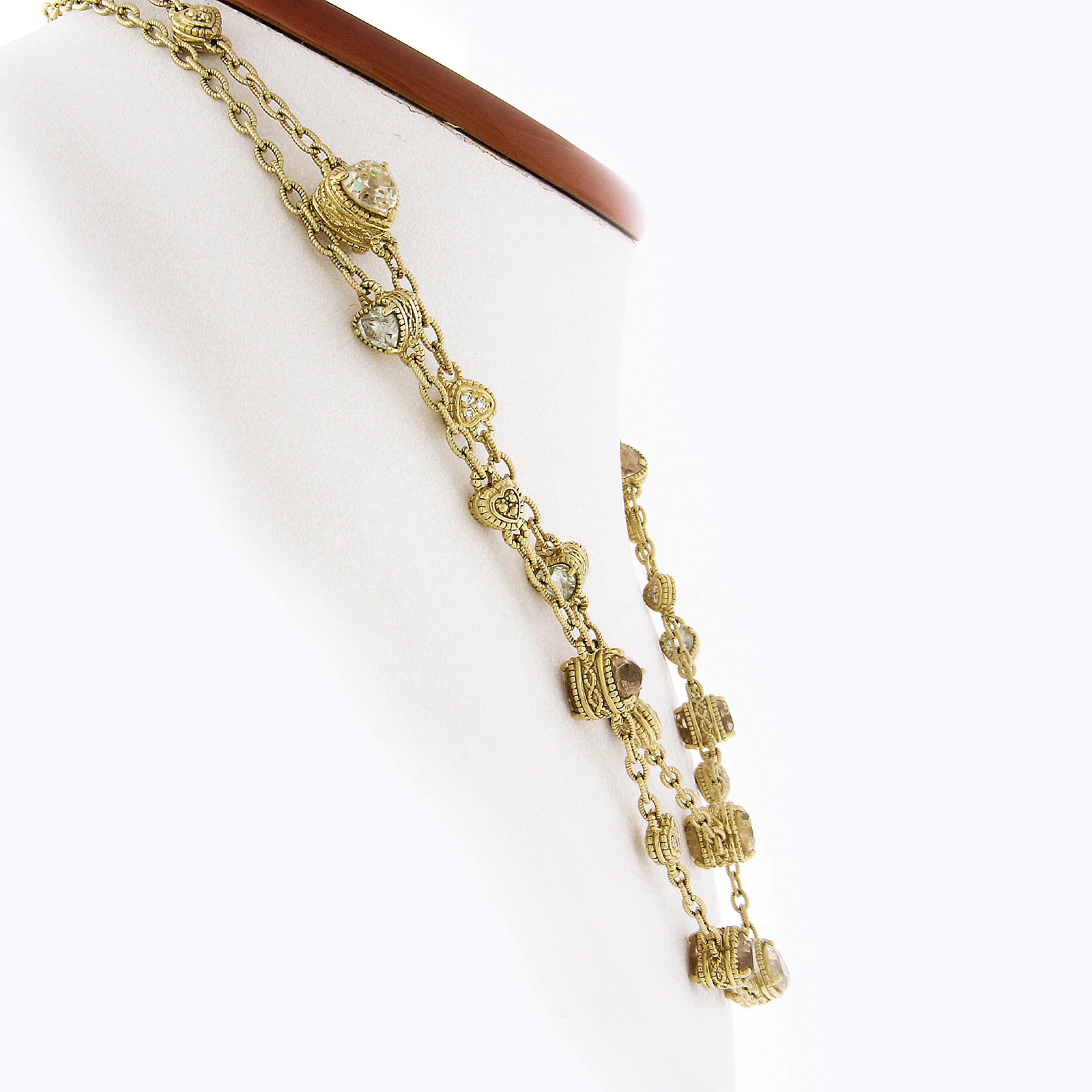Here we have a magnificent hearts by the yard chain necklace that is designed by Judith Ripka and crafted from solid 18k yellow gold. This long and very well made piece is constructed from textured cable link with beautifully detailed, dual-sided,