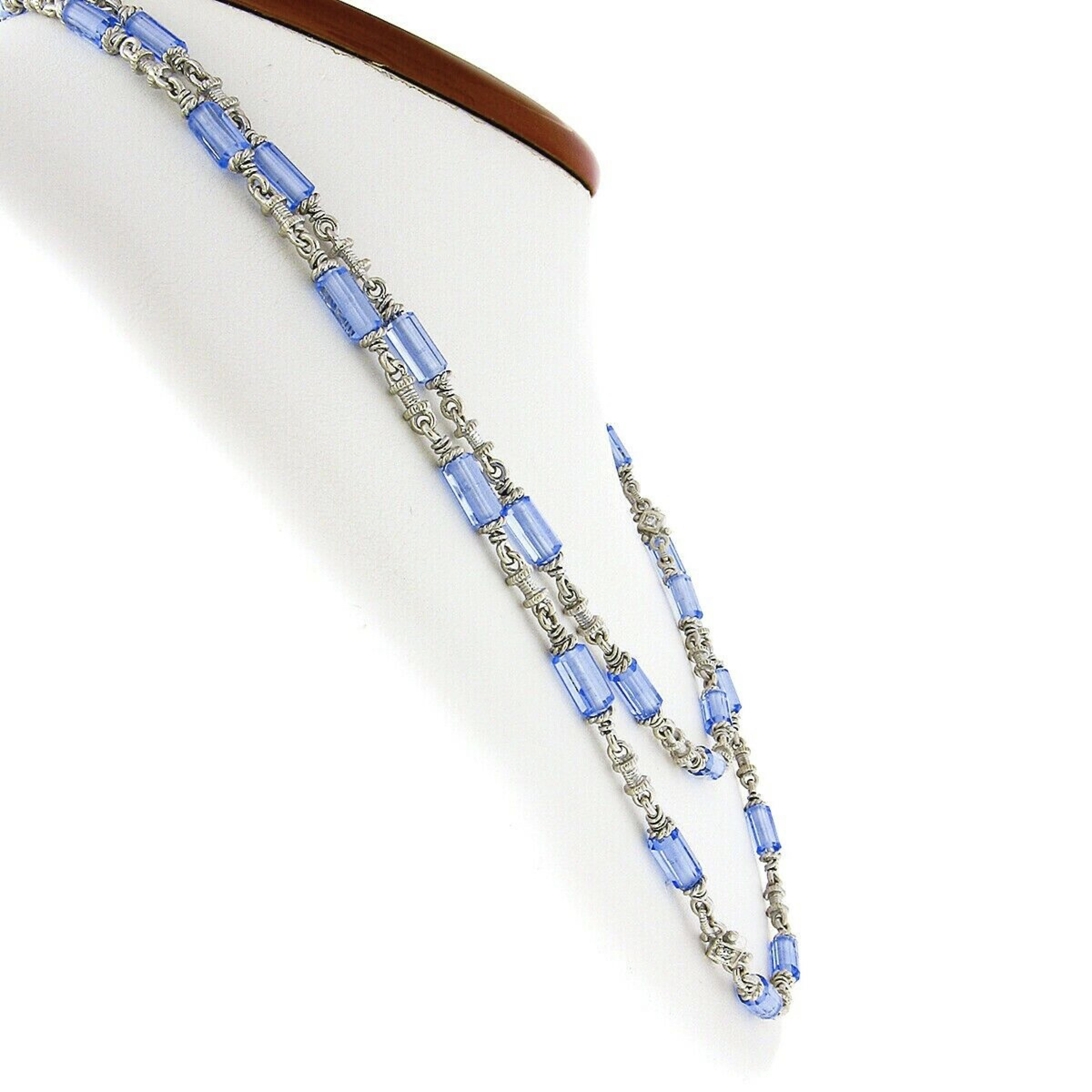 You are looking at an absolutely beautiful and well made Judith Ripka chain necklace that is crafted from solid 18k white gold and set with gorgeous, natural, blue topaz faceted tubes that have been carefully drilled through their center and set