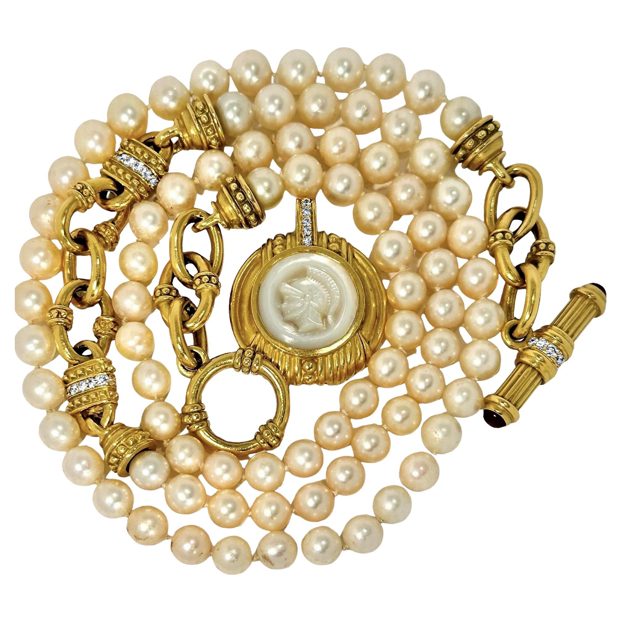 This wonderful, substantial and exquisitely detailed 18k yellow gold necklace from the esteemed designer, Judith Ripka, can best be described as monumental. Crafted in 18k yellow gold, it has at it's center a large Mother-of-Pearl cameo in the