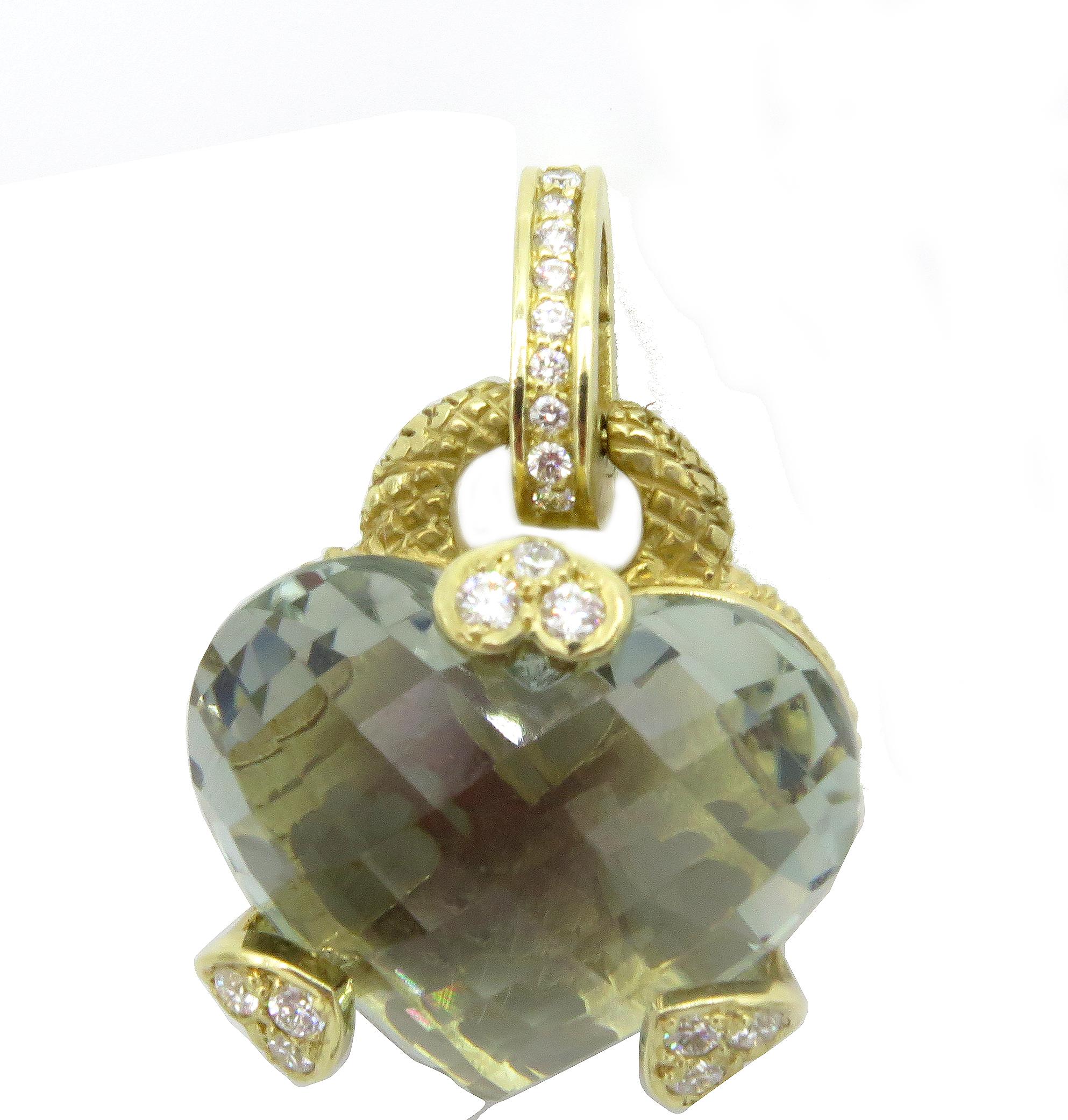 A lovely Judith Ripka 18k yellow gold heart pendent from the Judith Ripka Fine Jewelry Collection. Showcasing a stunning heart shaped prasiolite, the pendant also features heart shaped gold prongs and a gold hinge ball accented with 0.27cts of round