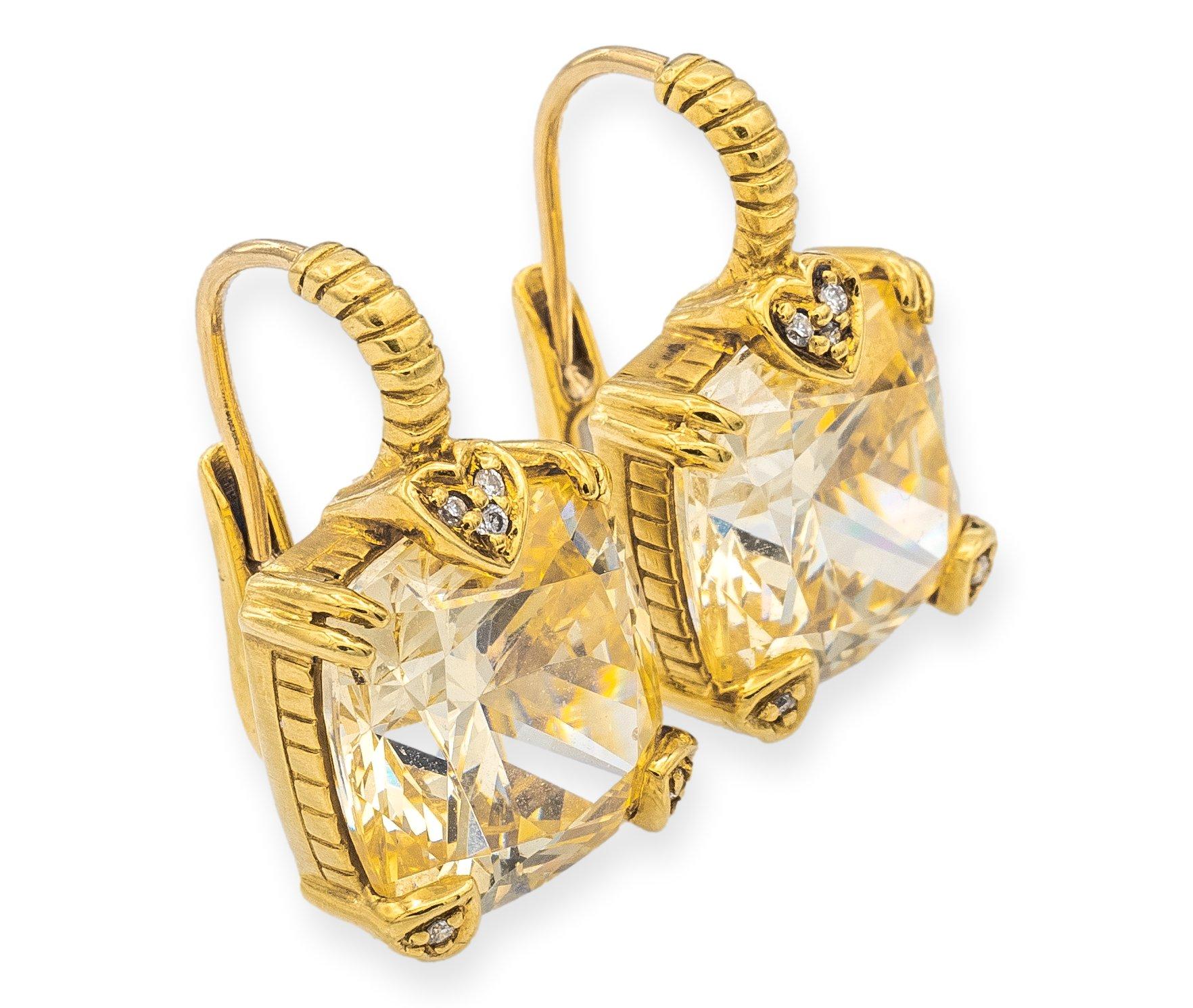 Judith Ripka Vintage Lever-Back style earrings are a classic and elegant choice. The earrings are finely crafted in 18 karat yellow gold. The earrings are adorned with 2 stunning cushion-shaped lemon quartz gemstone that exude a warm, sunny glow.