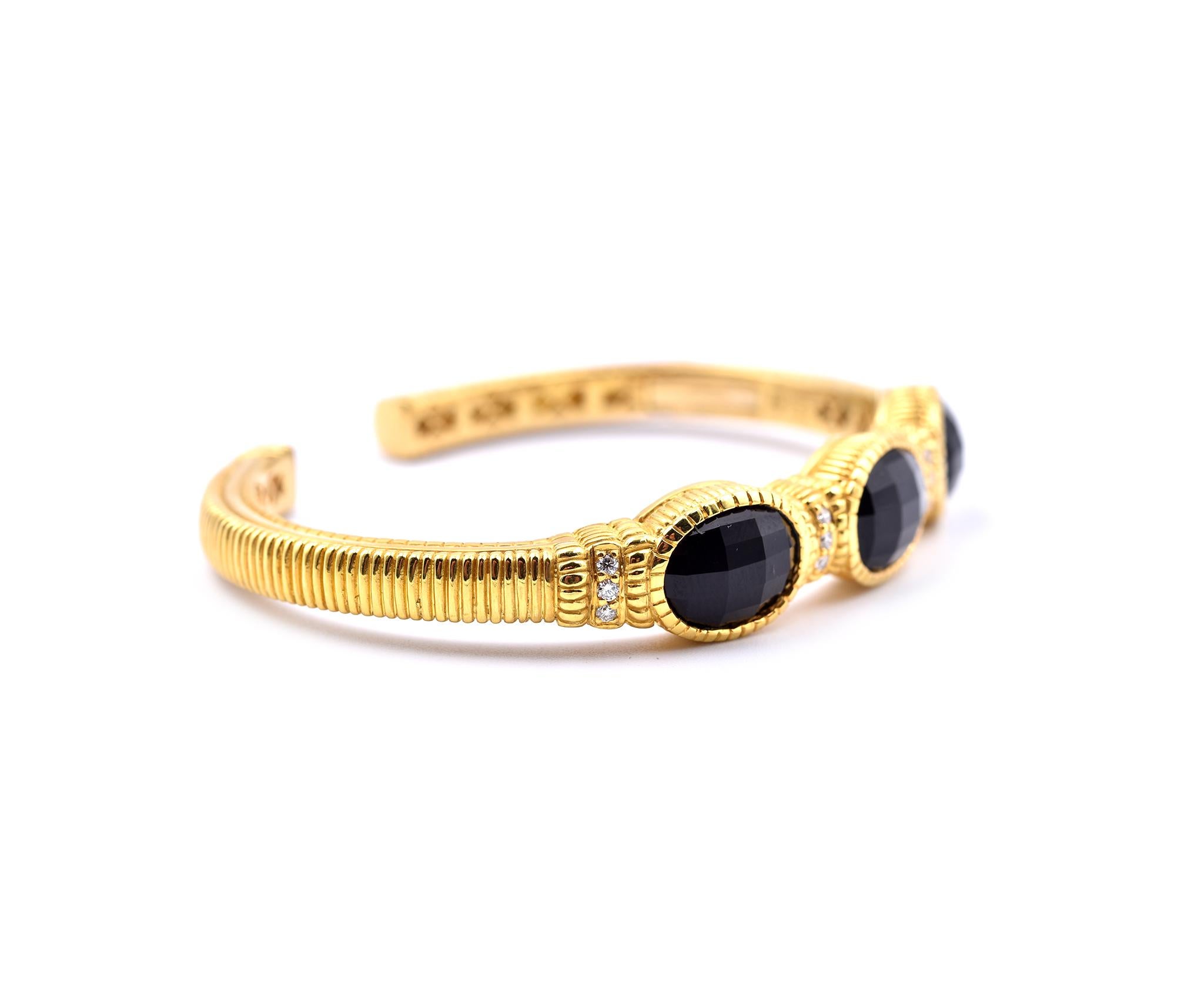 Designer: Judith Ripka
Material: 18k yellow gold
Diamonds: 12 round brilliant cut=0.25cttw
Color: G
Clarity: VS
Dimensions: bangle will fit a 6 ½-inch wrist and it is 3.92mm wide
Weight: 33.55 grams
