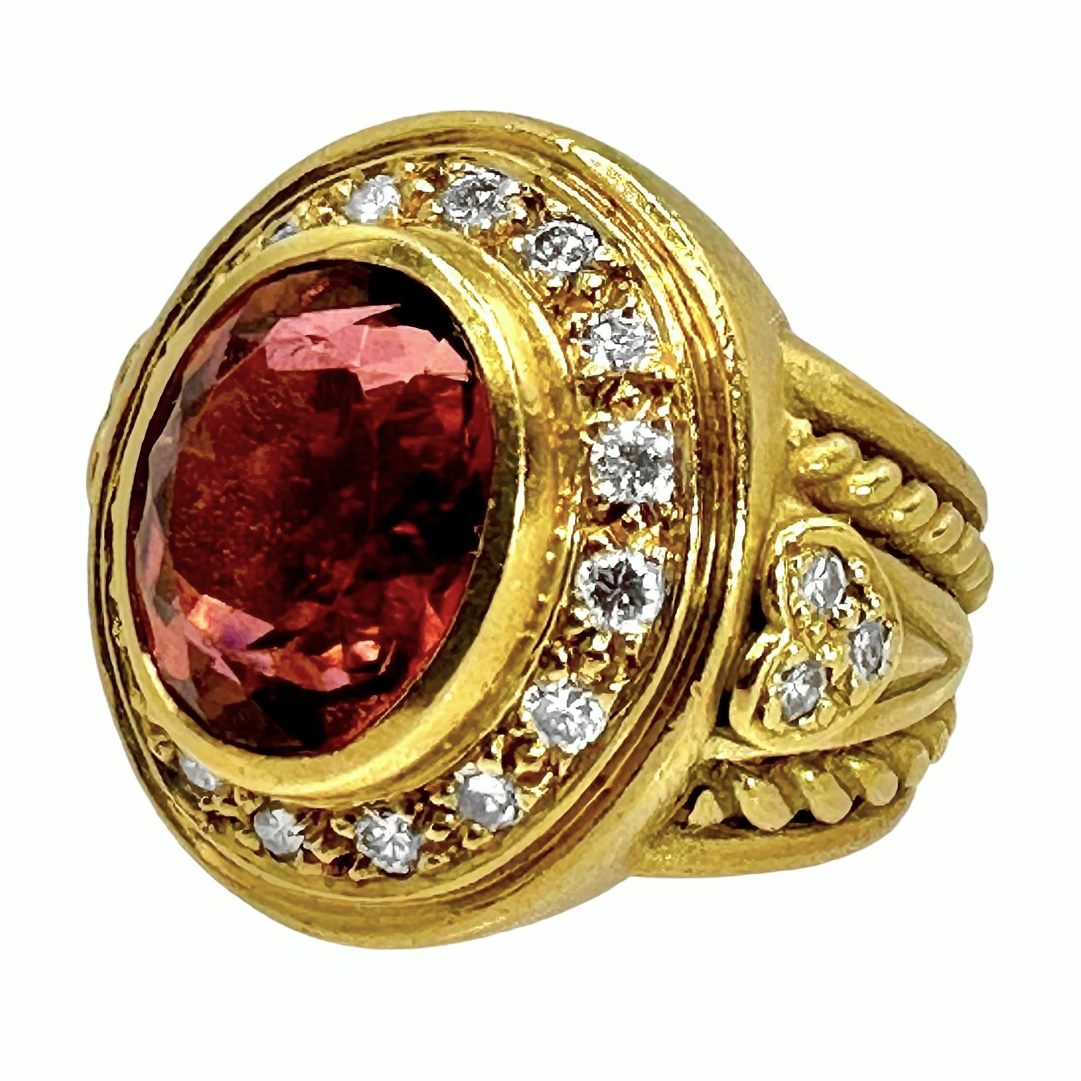 This satin finish 18K yellow gold Judith Ripka Classic Revival style fashion ring is set with one oval faceted, rubelite tourmaline, weighing approximately 3.50ct. This lovely and vibrant, pink champagne colored stone is surrounded by a continuous