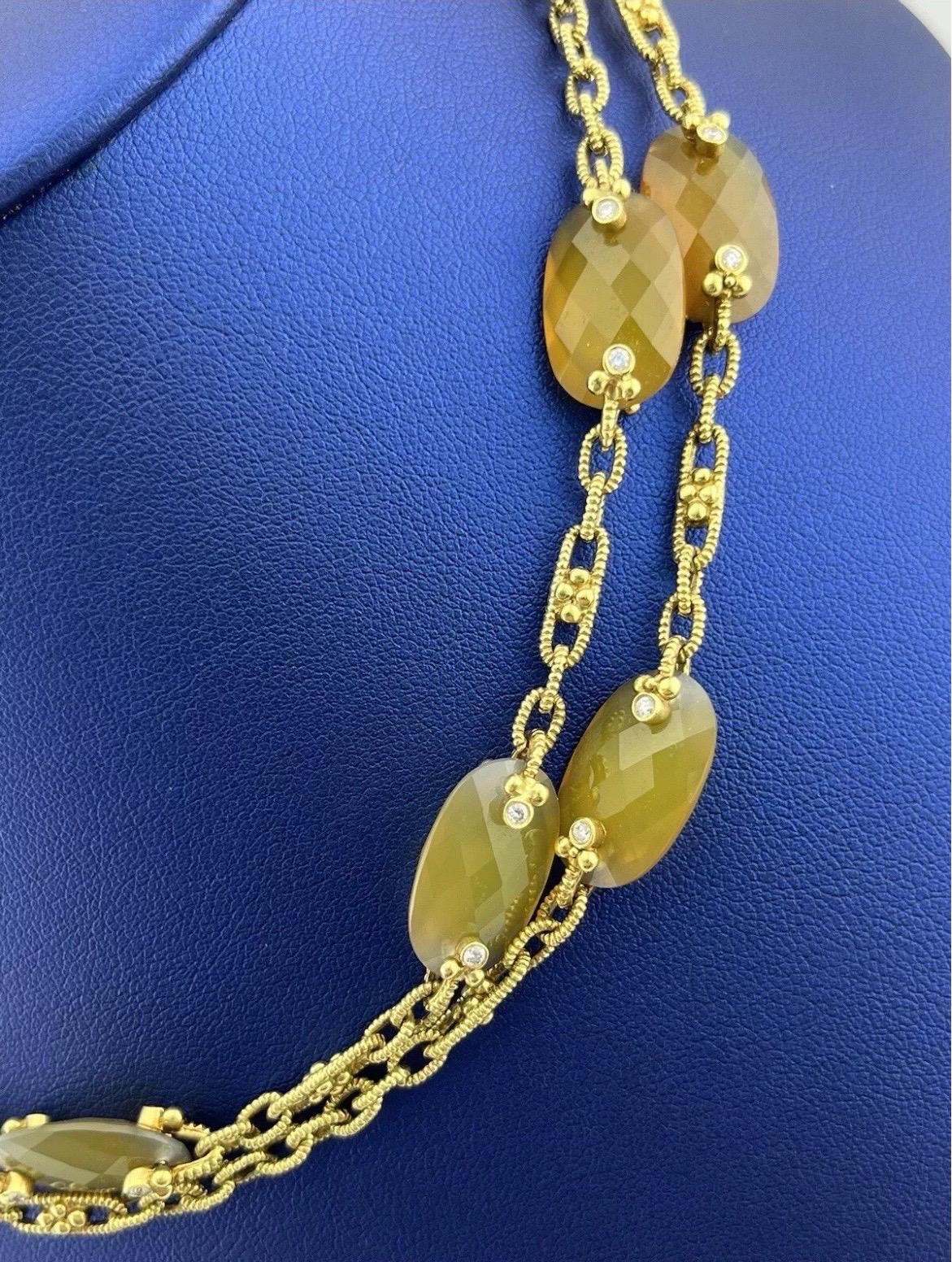 The Judith Ripka 18k Yellow Gold Two-Sided Diamond Citrine Sautoir Necklace is a captivating masterpiece that exudes sophistication and elegance. Crafted in rich 18k yellow gold, this necklace features a stunning sautoir design, offering a luxurious