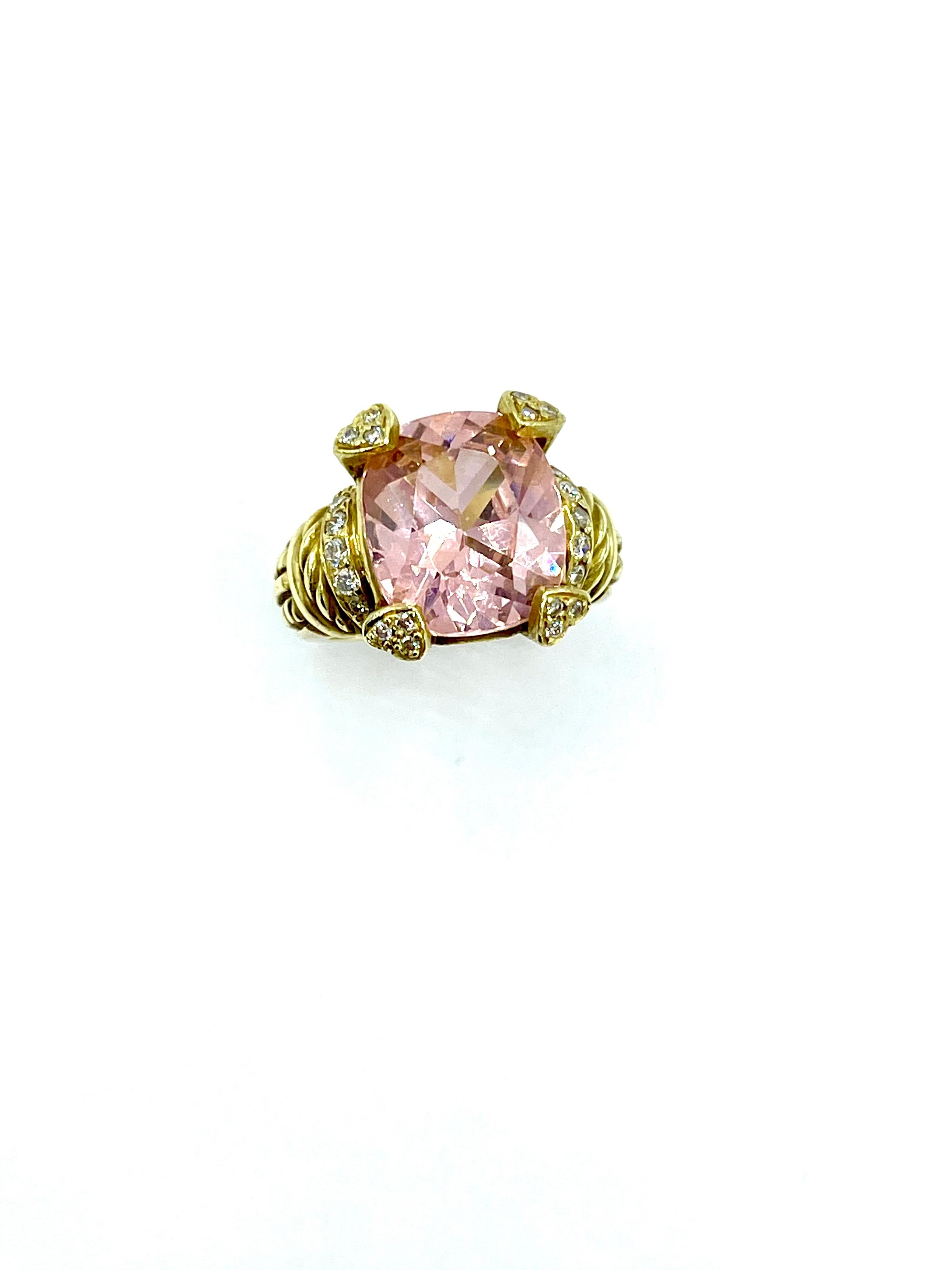 A beautifully vibrant 6.89 carat cushion cut pink quartz and diamond cocktail ring designed by Judith Ripka.  The quartz is set with with four diamond double prongs, with a single row of round brilliant diamonds on each side.  There is a total of