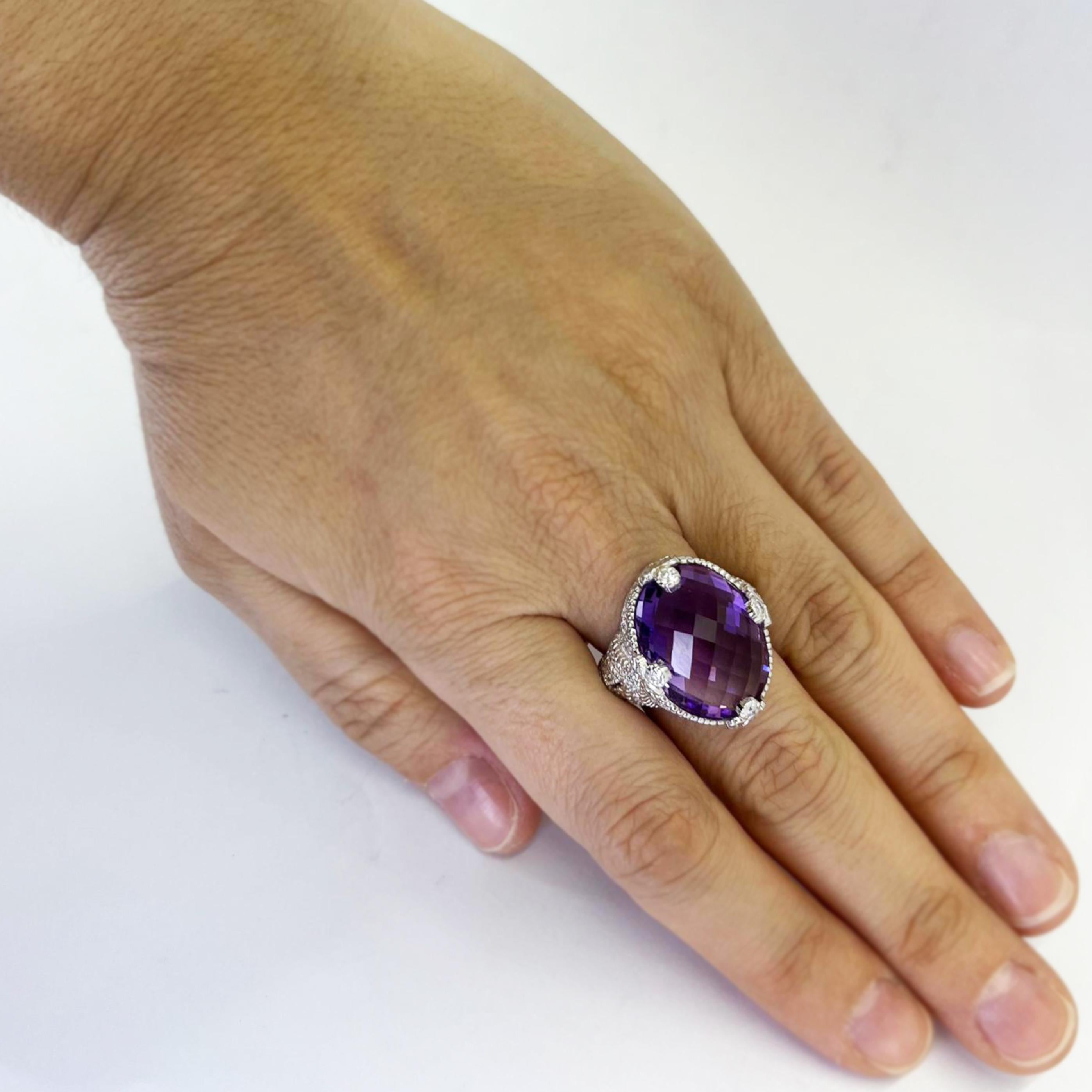 Judith Ripka 18 karat white gold cocktail ring featuring a 20mm x 15mm checkerboard cut oval amethyst accented by 80 round diamonds of VS clarity and G color totaling 0.50 carats. $5,000 MSRP. Finger size 7.25; includes one sizing service upon