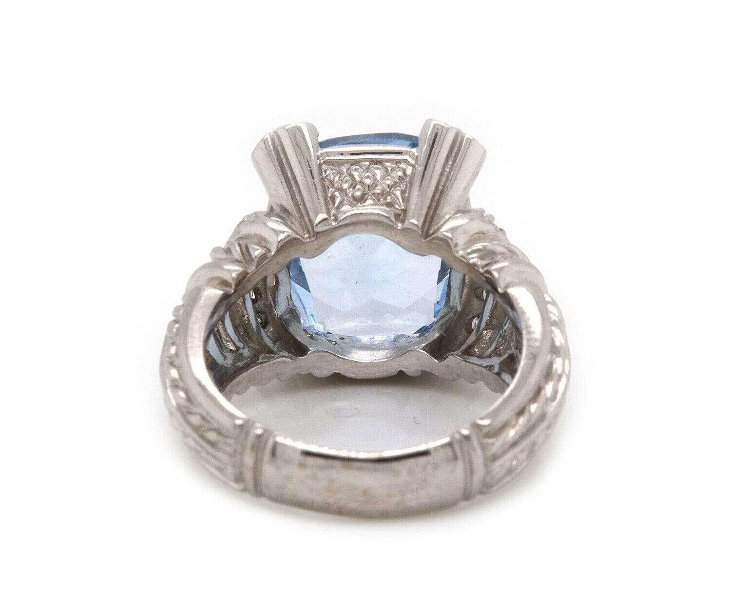 Judith Ripka Blue CZ & 0.45 CTW Diamond Ring in 18K

Judith Ripka CZ & Diamond Ring
18K White Gold
Diamond Weight: Approx. 0.45 CTW
Blue CZ Size: Approx. 11 X 13.5 MM
Ring Size: 5.75 (US)
Weight: Approx. 12.3 Grams
Stamped: Ripka,