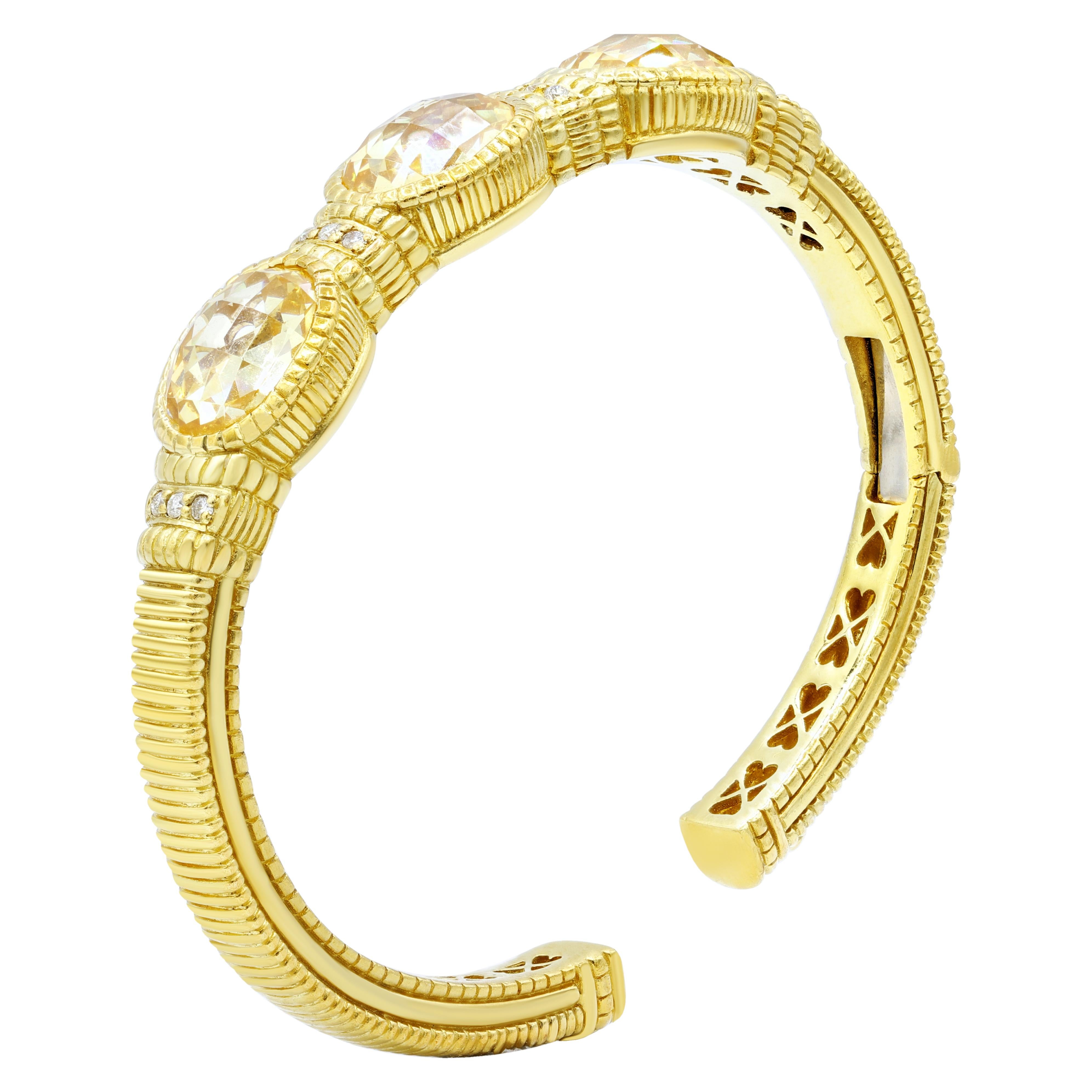 18K yellow gold bangle bracelet features 24.00 ct oval citrines and 0.60 cts of round diamonds