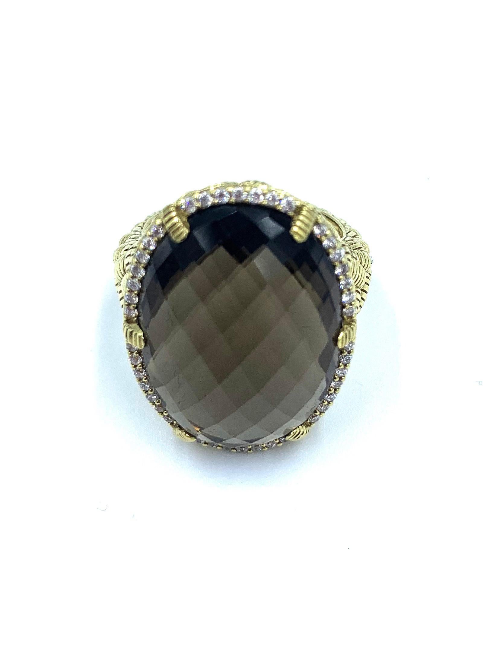 This Briolette Diamond Ring is from the Judith Ripka Fine Jewelry Collection. Set in a braided style 18k yellow gold band, this beautifully faceted briolette gemstone is held in place by 6 gold, ribbed prongs and framed by 0.25cts of round, bead-set