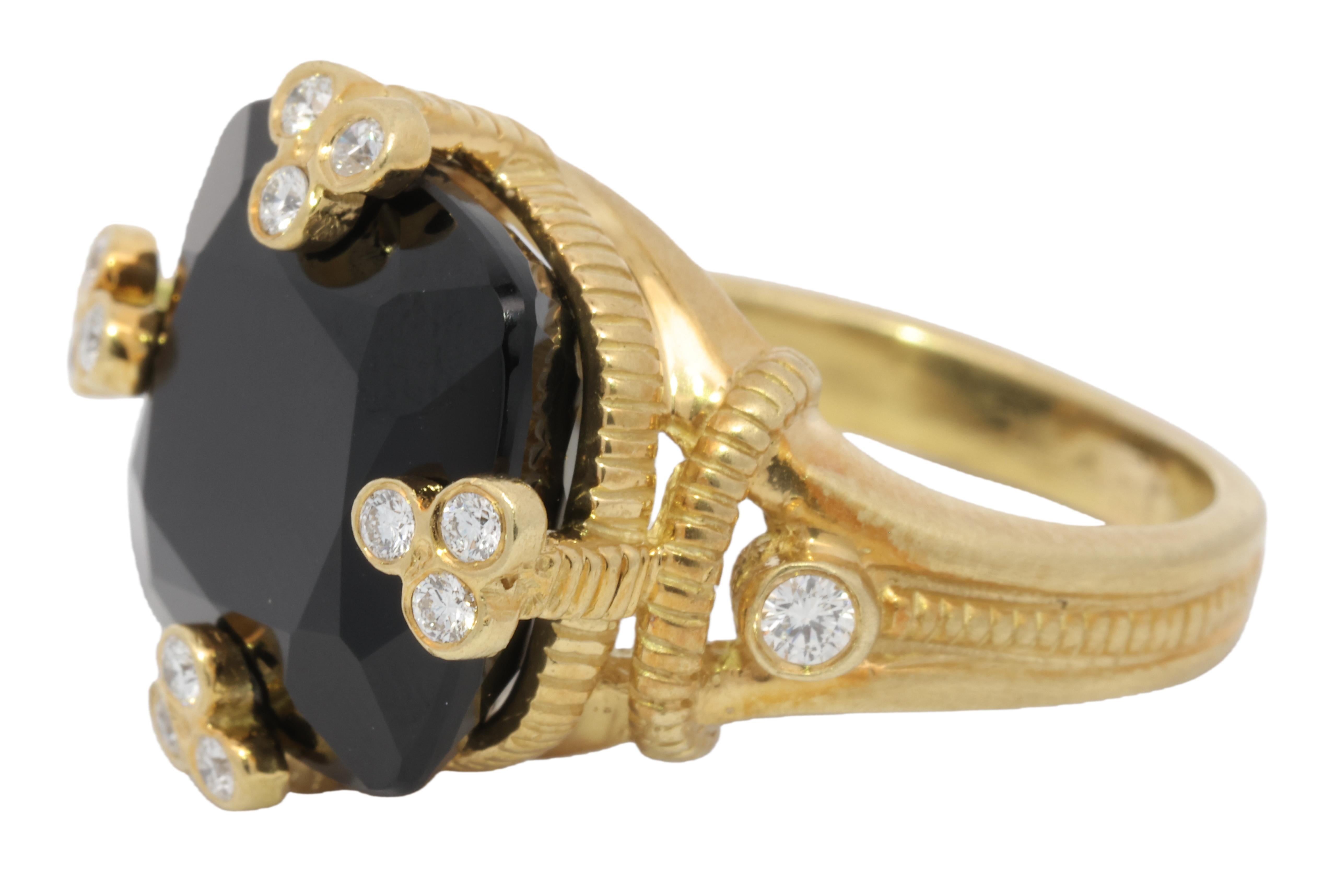 Ring size: 5.5

Absolutely gorgeous Judith Ripka onyx and diamond cocktail ring. A true embodiment of timeless sophistication, this masterpiece seamlessly blends sophistication and boldness, showcasing the designer's impeccable taste and