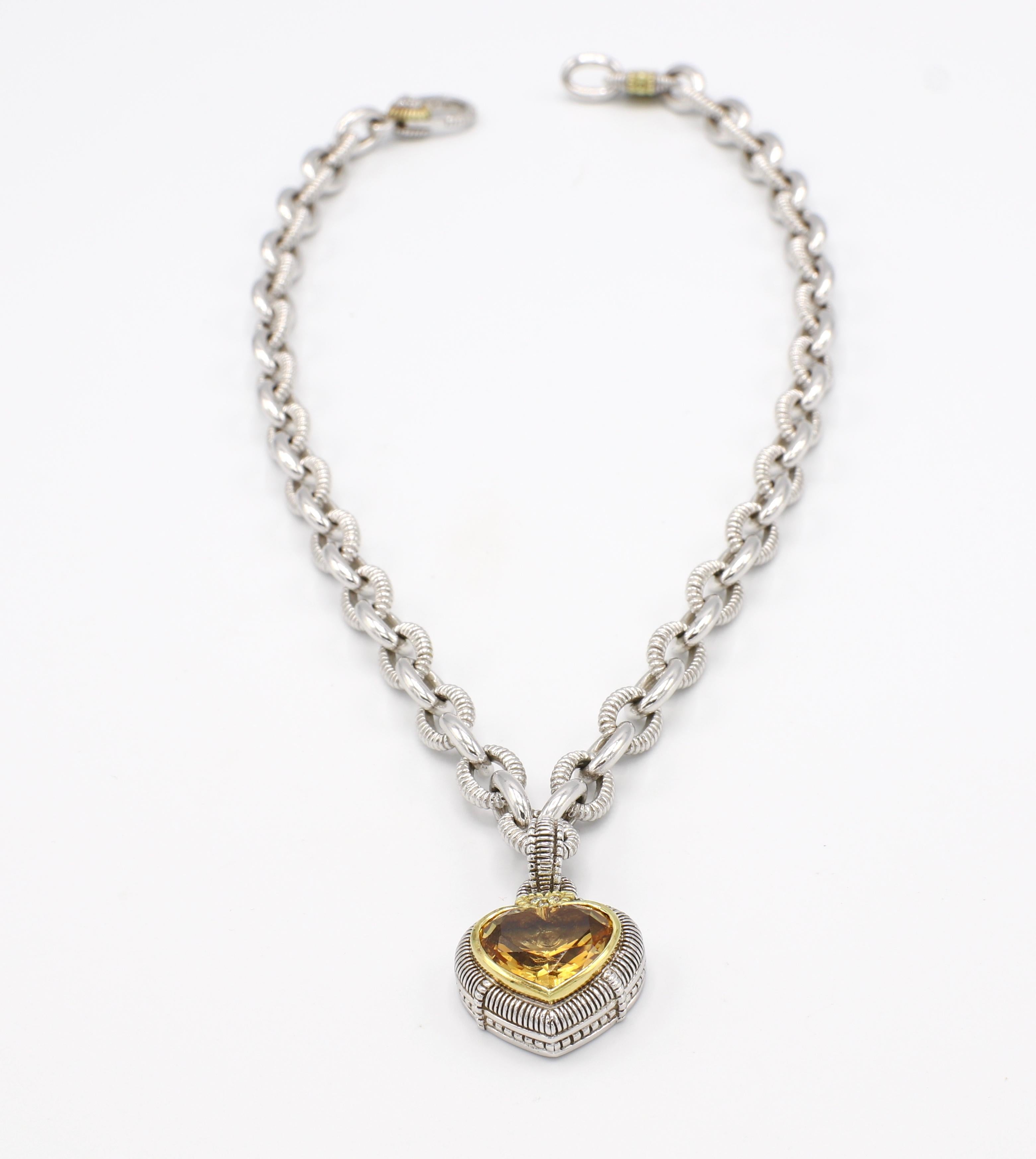 Judith Ripka Diamond & Citrine Sterling Silver & 18K Gold Heart Pendant Necklace

Metal: Sterling silver & 18k yellow gold
Weight: 68.1 grams
Diamonds: 6 round brilliant cut diamonds, approx. .06 CTW G VS
Chain length: 17.5 inches (18.75 with