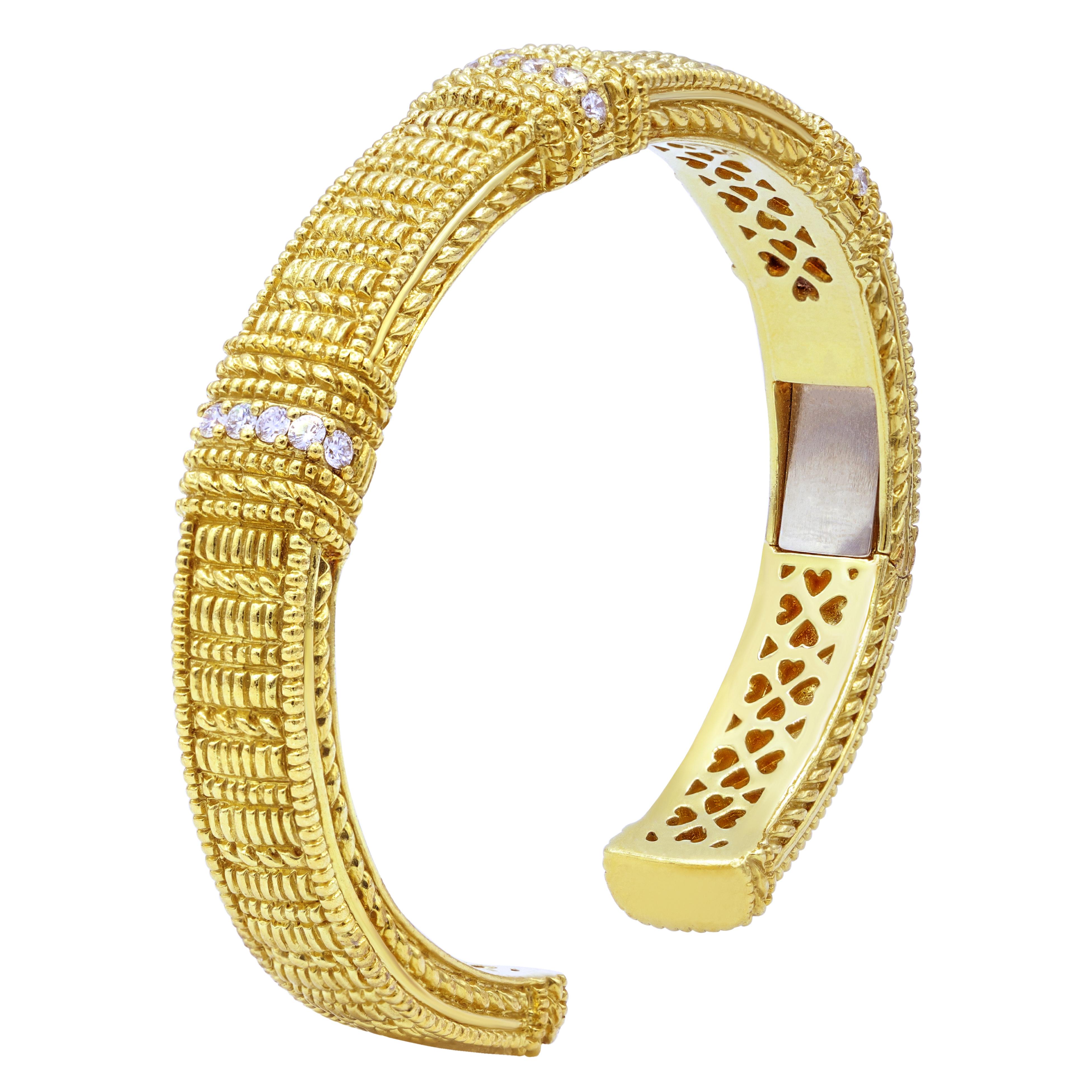 Judith Ripka Heavy Diamond Hinged Bangle In 18k Yellow Gold features 0.60 carats of diamonds. 
