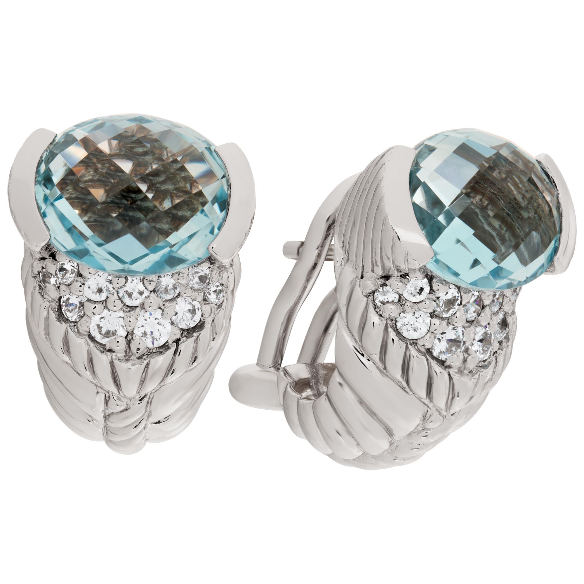 Judith Ripka earrings in sterling silver with blue topaz and cz accents. Hanging length 20 mm.
