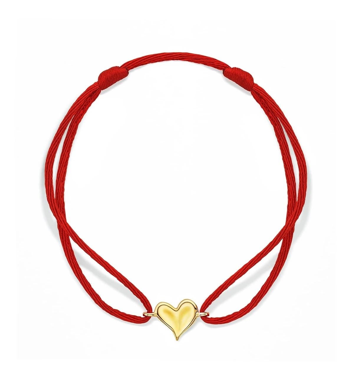 Designed as an expression of love, the Eros Collection evokes the true beauty of the one who wears it.

18K Gold
Red Cord
Diameter: 3
