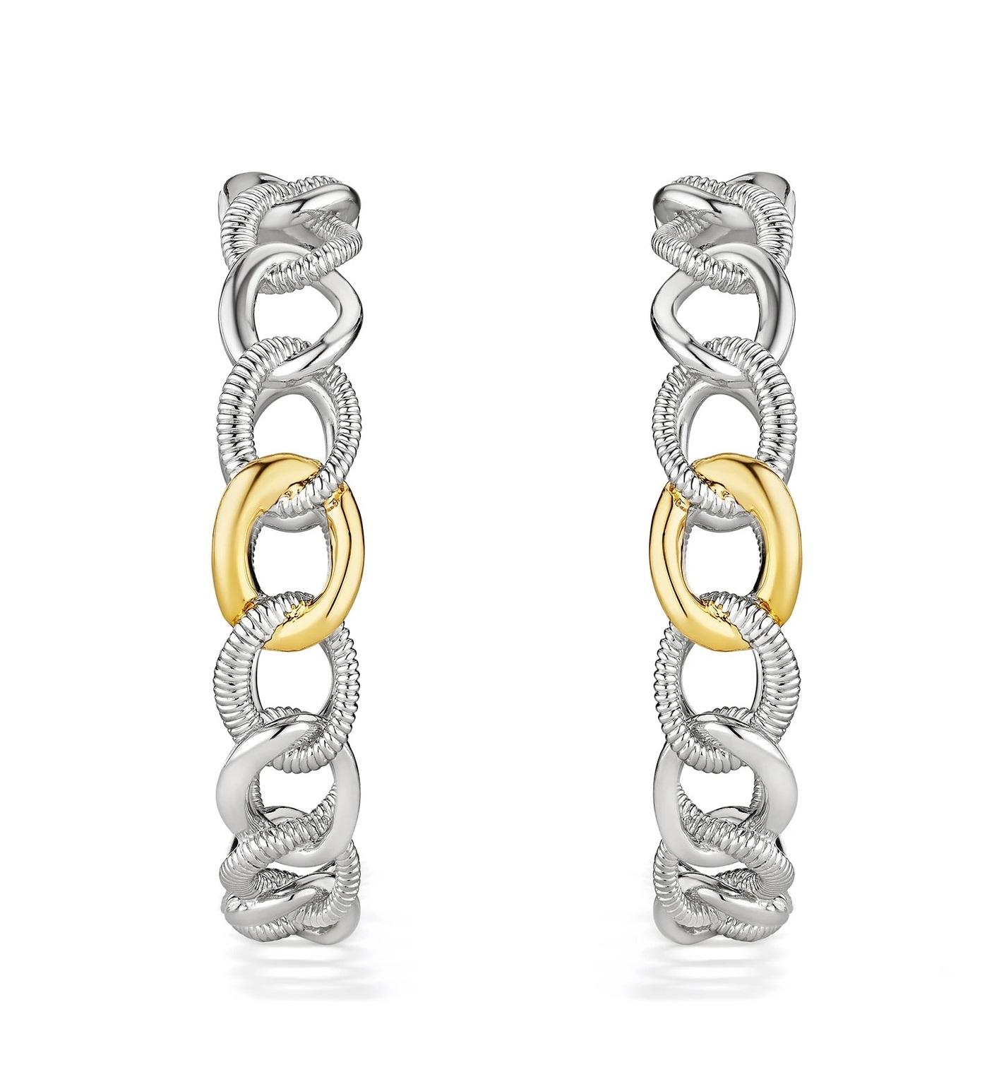 Our Eternity Earrings explore a variety of the textures, woven together in a shape that represents the bond of love that is both infinite and everlasting.

Sterling Silver with 18K Gold
Width: ¼