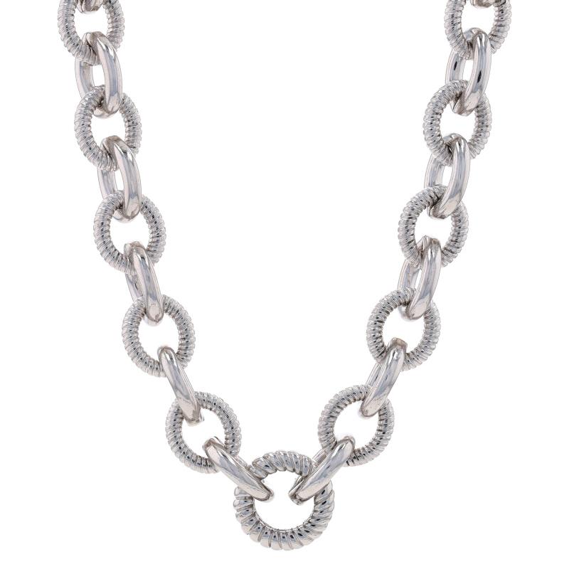 Brand: Judith Ripka

Metal Content: Sterling Silver

Chain Style: Fancy Cable
Necklace Style: Chain
Fastening Type: Lobster Claw Clasp
Features: Smooth & textured finishes with a larger center link to showcase an enhancer
