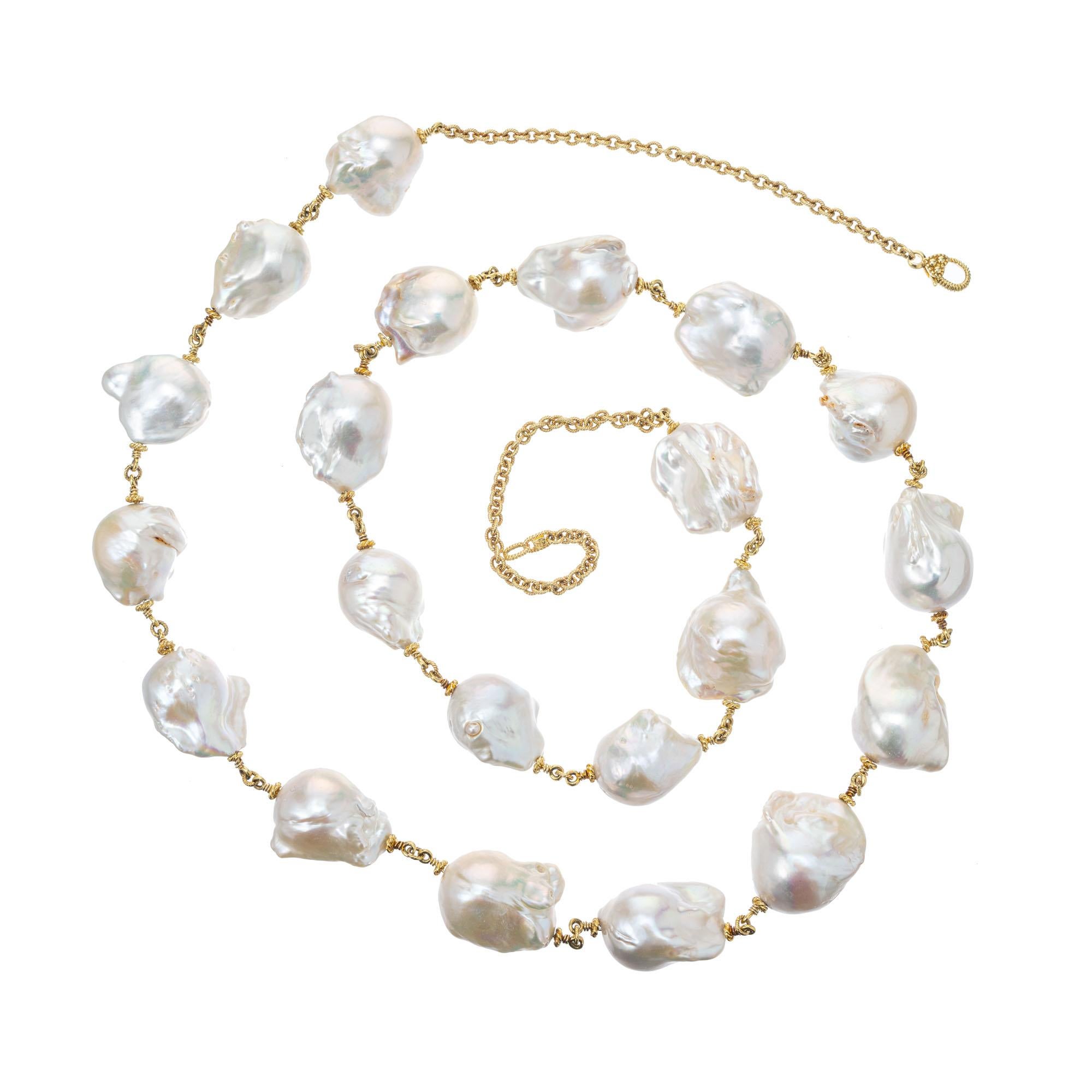 36 Inch long Paloma Pearl Necklace by Judith Ripka. 18k yellow gold chain with 21 large well matched freshwater baroque pearls. Can be worn long or doubled. 36 inches long. 

21 baroque freshwater white gray hue pearls, 14-17mm x 20-23mm
18k yellow