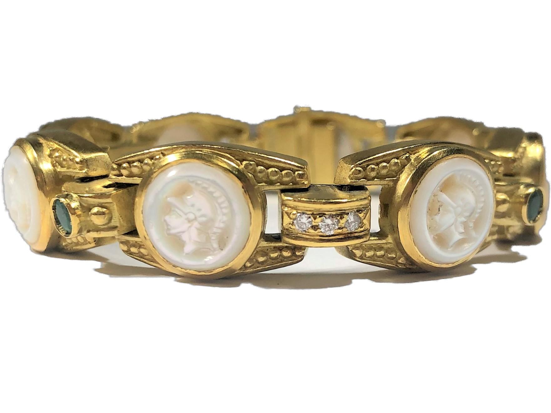 An 18K yellow gold bracelet comprised of 8 links and 8 connecting links, by Judith Ripka. Each link features a Roman centurion carved from mother of pearl, and bezel set. The connecting links alternate between collet set emeralds and pave' set