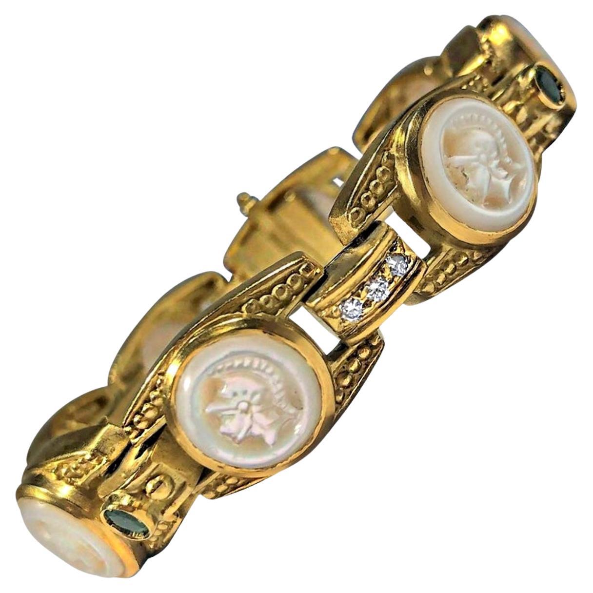 Judith Ripka Gold Bracelet with Diamonds Emeralds and Carved Mother of Pearl