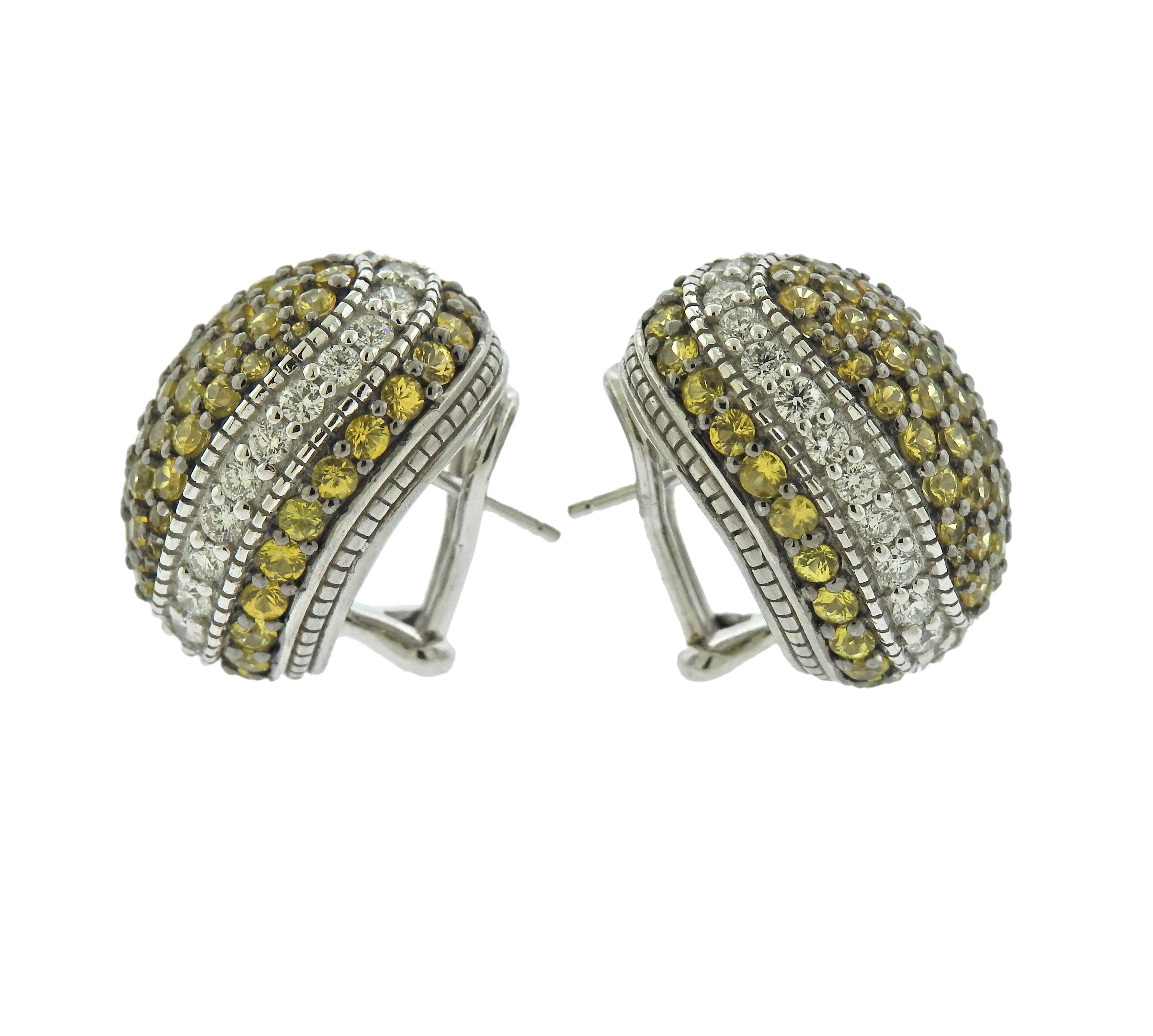 Splendid Judith Ripka 18K gold earrings featuring lemon citrine and approximately 1.45ctw of diamonds. Earrings measure 21mm X 16mm and weigh 21.3 grams. Marked JR and 18k. 