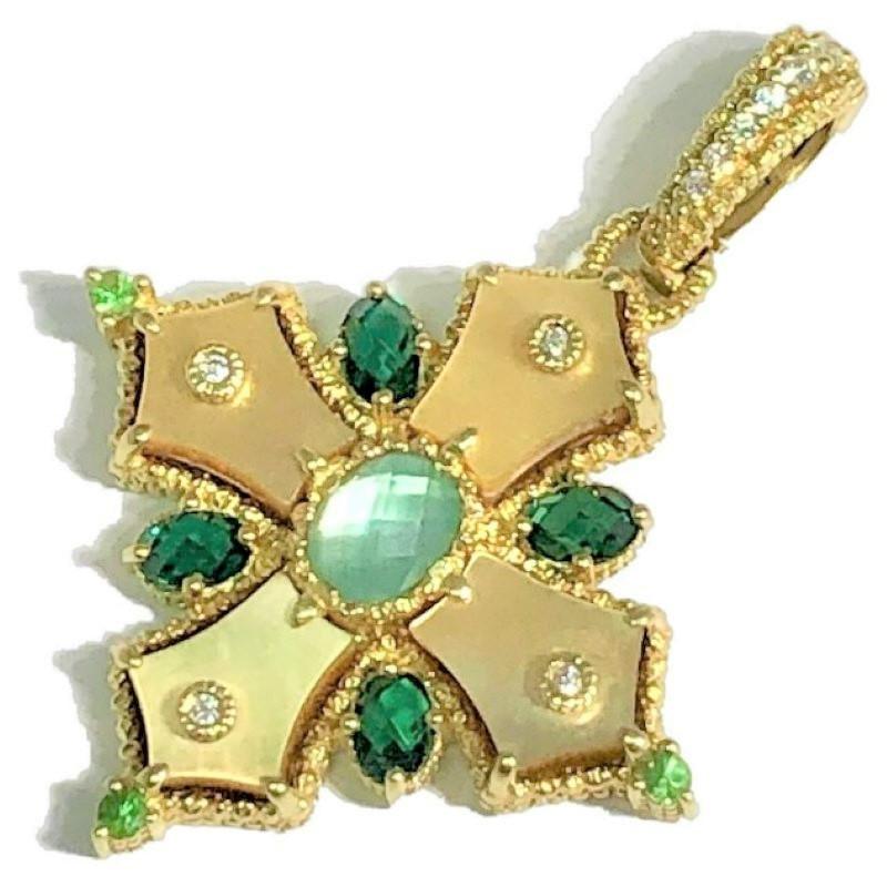 This imaginative and lovely Judith Ripka Maltese cross pendant incorporates golden mother of pearl panels, green tourmaline, peridot and a splash of brilliant cut diamonds. Total diamond weight is .20ct and overall quality is G Color and VS1