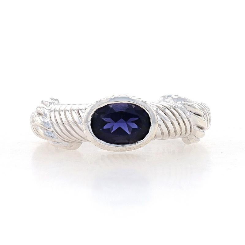 Size: 5

Brand: Judith Ripka

Metal Content: Sterling Silver

Stone Information

Natural Iolite
Carat(s): .63ct
Cut: Oval
Color: Purple

Total Carats: .63ct

Style: Solitaire
Features: Smoothly finished with etched detailing & east-west set