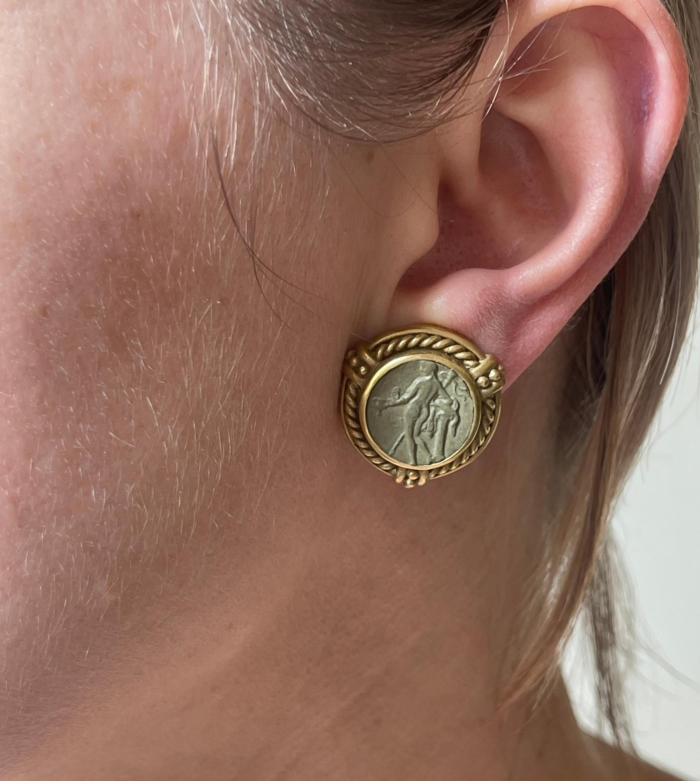Pair of 18k yellow gold earrings by Judith Ripka, set with lava cameos, depicting a  nymph silhouette. Earrings have hooks to attach drops. Measure 7/8