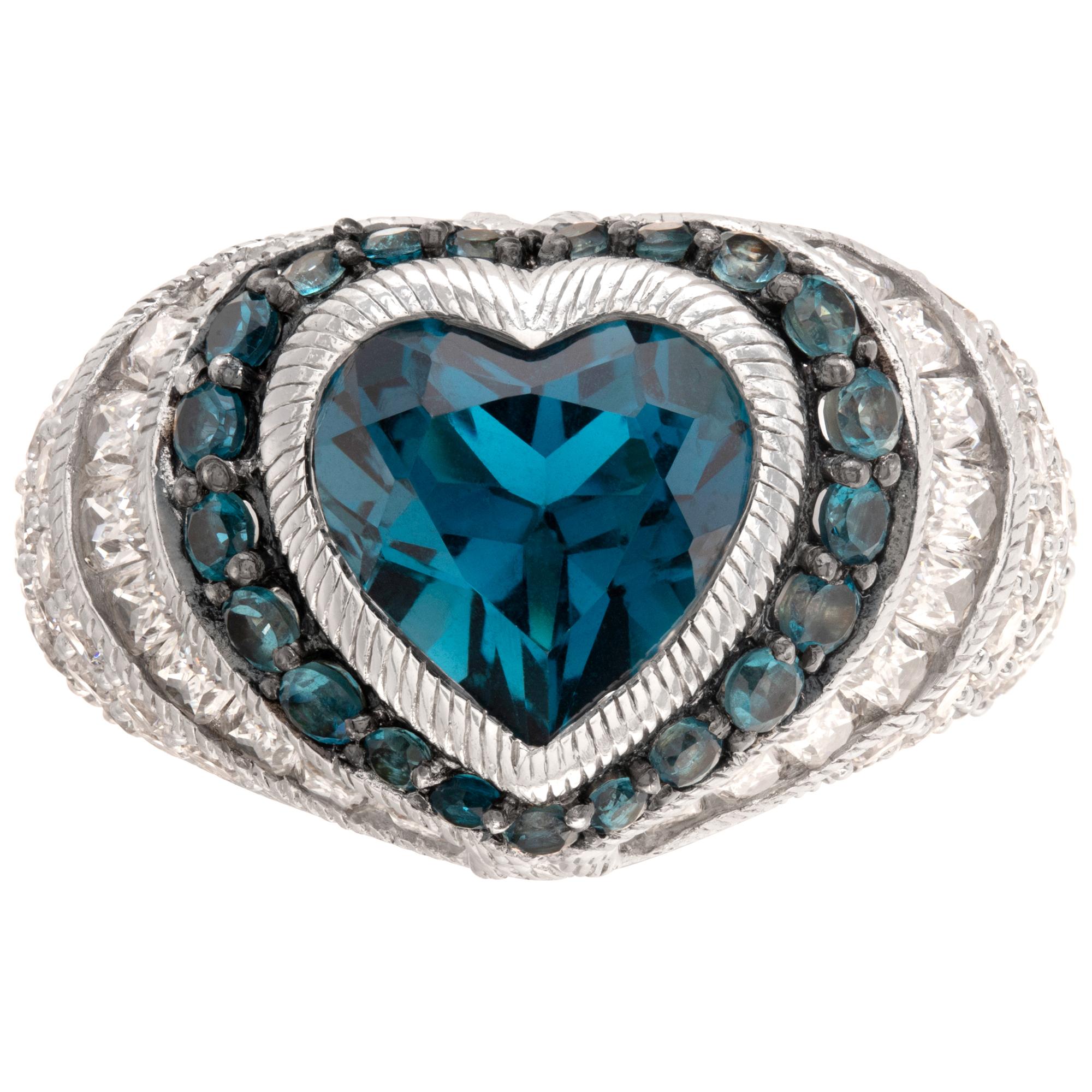 Judith Ripka London Blue Topaz heart-shaped ring in sterling silver. Size 7, head 15mm thick, shank 5mm thick.This Judith Ripka ring is currently size 7 and some items can be sized up or down, please ask! It weighs 8 pennyweights and is Sterling