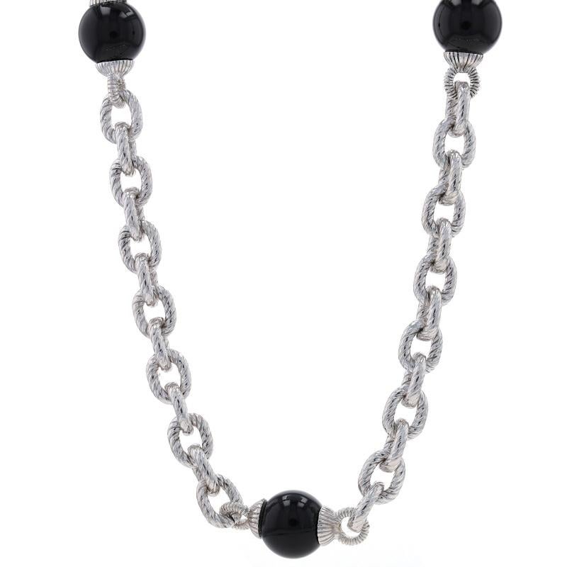 Brand: Judith Ripka

Metal Content: Sterling Silver

Stone Information
Natural Onyx
Cut: Bead
Color: Black

Chain Style: Fancy Cable
Necklace Style: Chain Station
Fastening Type: Lobster Claw Clasp
Features: Textured Detailing

Measurements
Length: