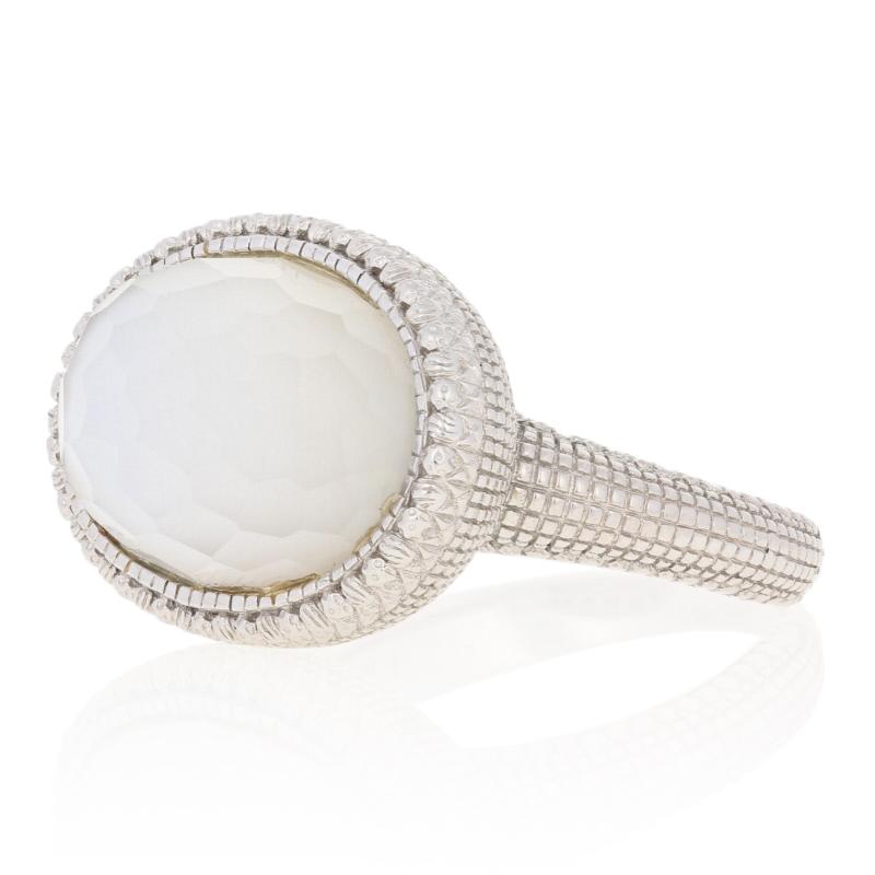Step out in style with Judith Ripka! This chic designer cocktail ring hosts a luminous east-west set white mother of pearl under clear quartz stone featured in an ornate 18k white gold mount.

This ring is a size 10 1/4.

Brand: Judith Ripka 

Metal
