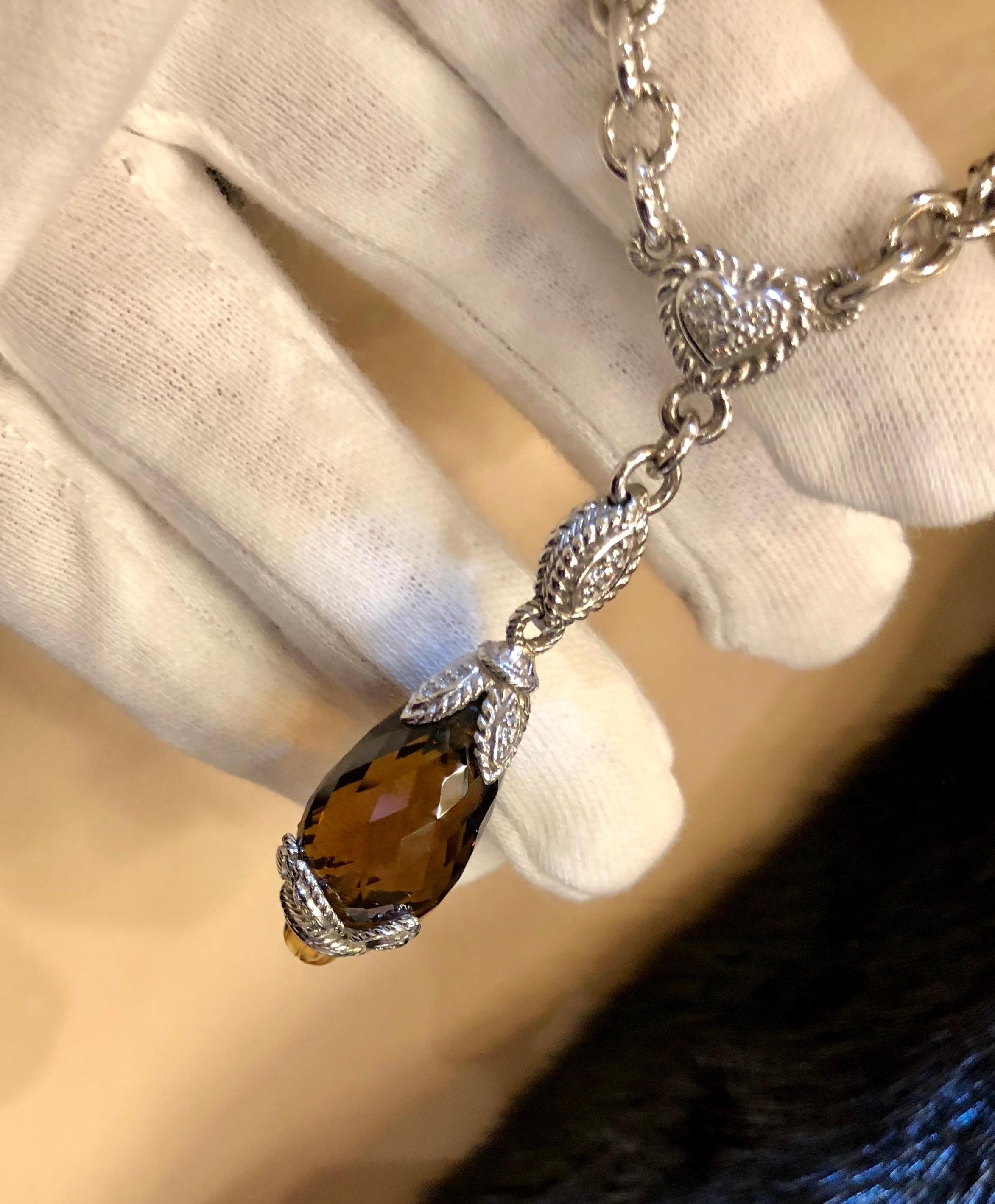 Fashionable necklace from Beverly Hills Rodeo Drive designer, Judith Ripka, features a gorgeous, large pineapple cut smoky topaz stone, suspended by an elaborate, diamond pave embellished sterling silver bale and chain with a leaf and heart motif,